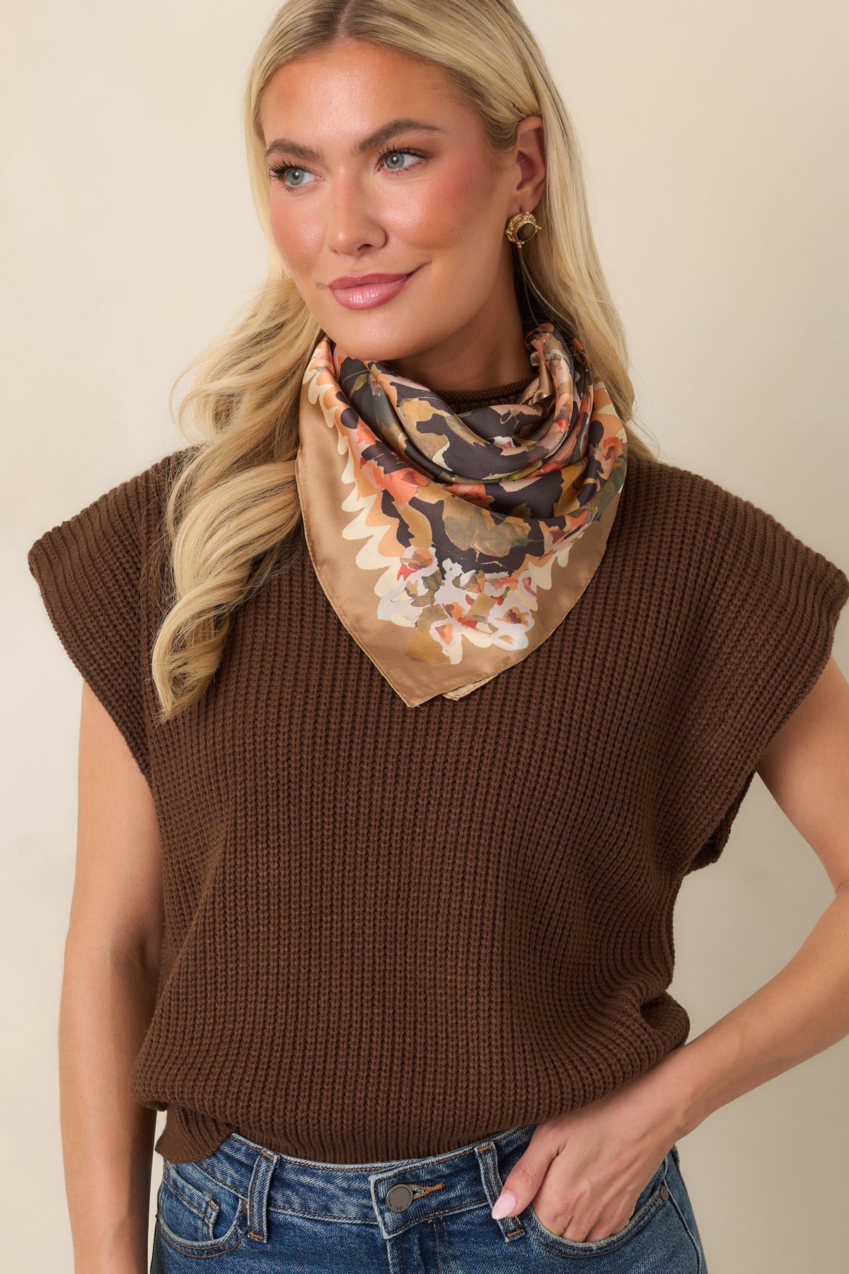 Ribbed knit top featuring a wide hem and relaxed bodice for a softly defined waistline.