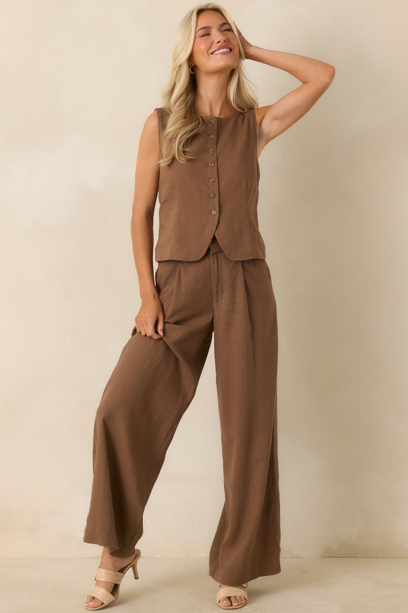Rich brown vest showcasing subtle seam detailing, structured shaping, and a versatile sleeveless design.