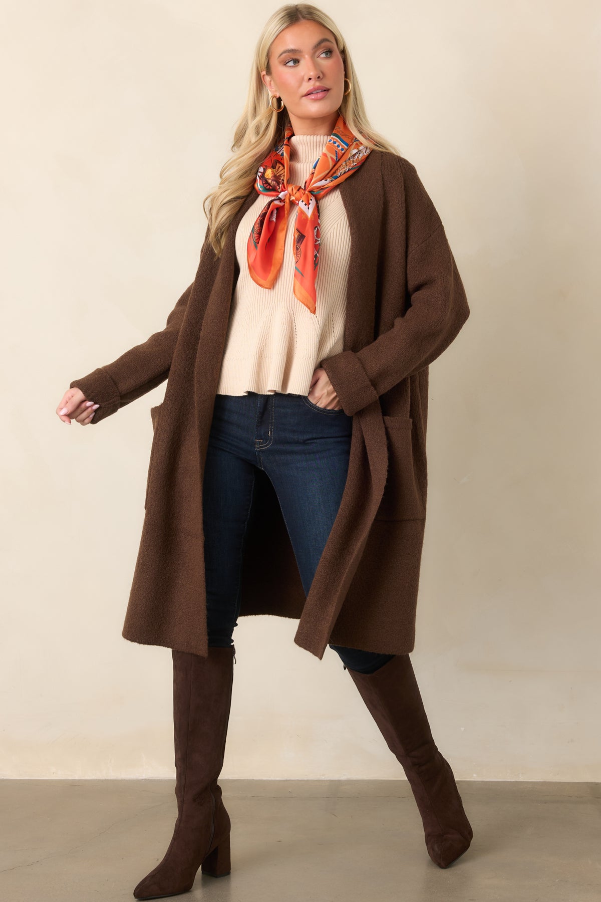 Rich chocolate knit creates an easy cardigan silhouette finished with oversized patch pockets and relaxed sleeves.