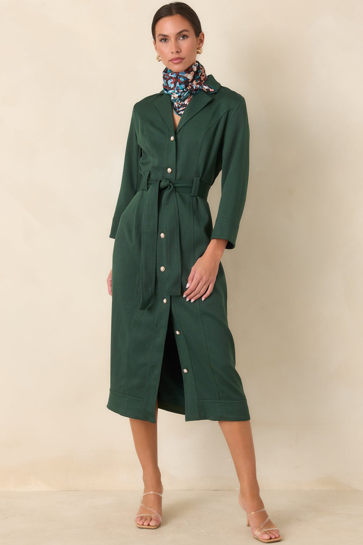 Rich green midi dress with a removable tie belt and polished button front.