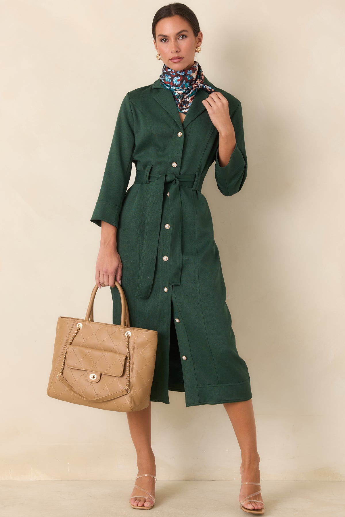 Rich green midi dress with wide stitched bands finishing the cuffs and hem.