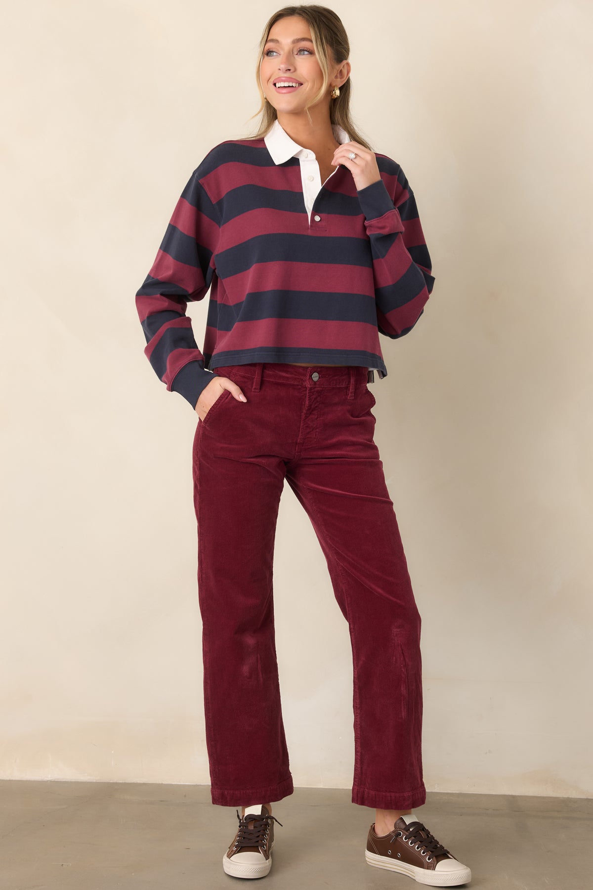 Rich wine corduroy pants with a clean straight-leg fit, classic waistband, belt loops, zip fly, and button closure.