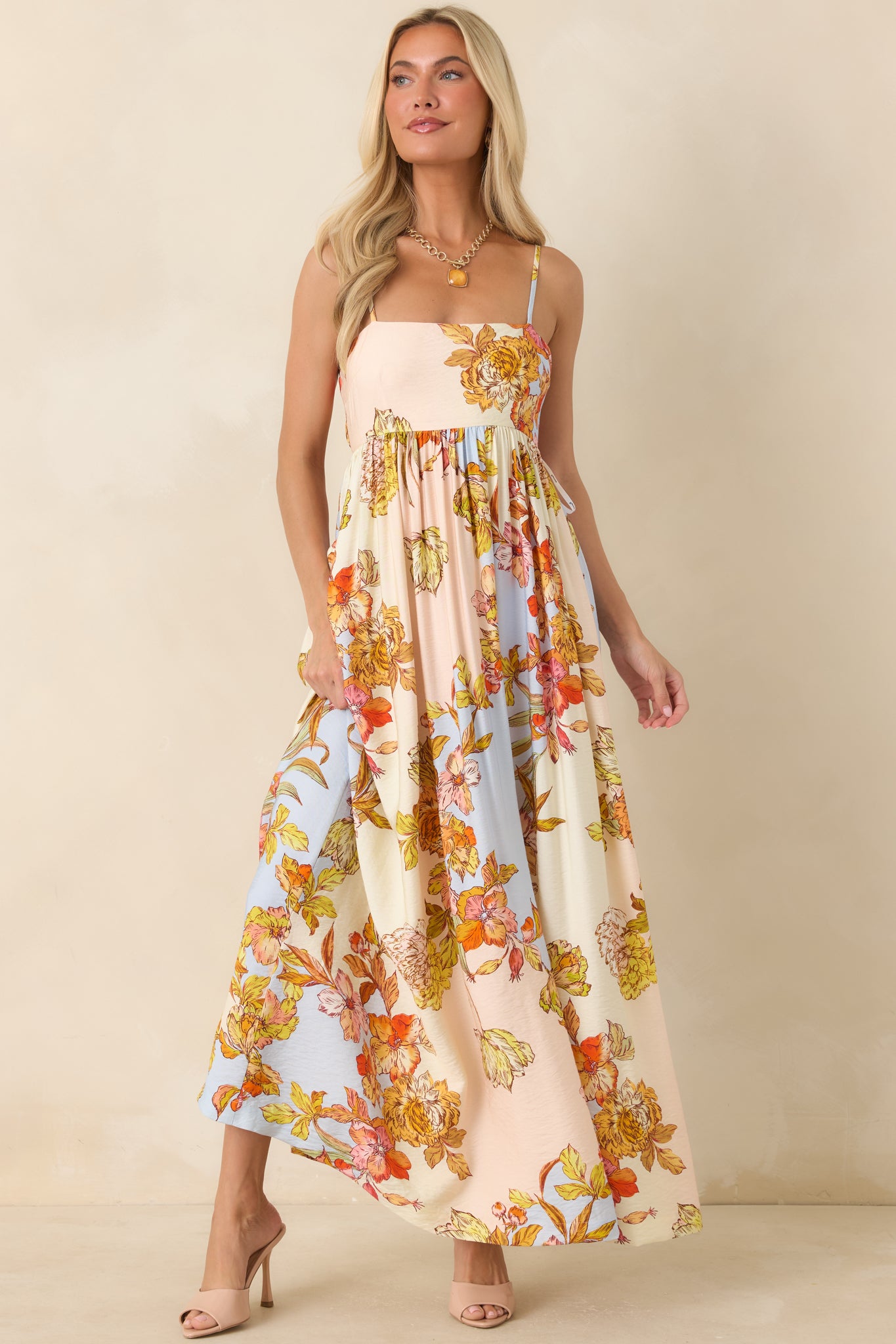 Romantic floral maxi dress featuring a flattering gathered bodice and an effortlessly graceful silhouette.