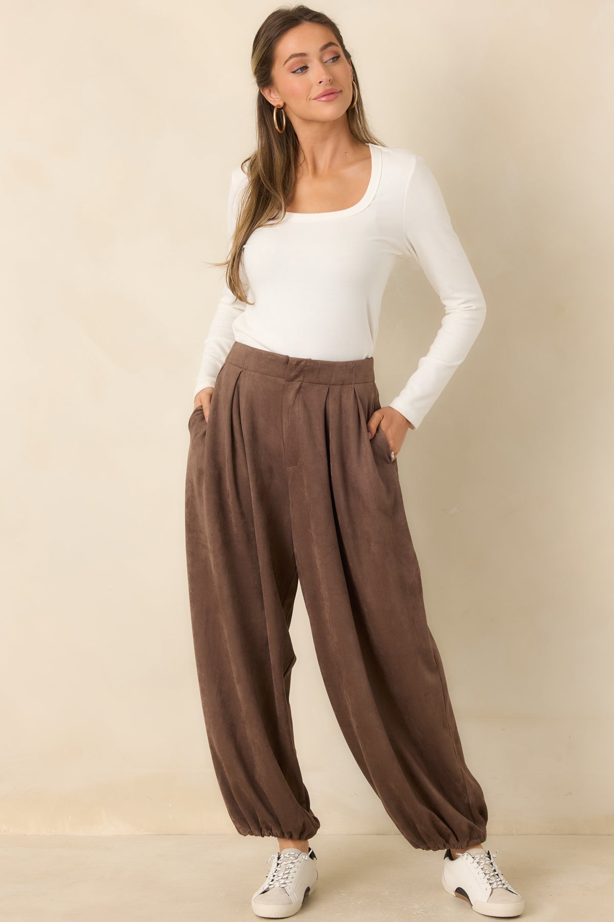 Roomy faux suede pants with front pleating and rounded legs that taper at the ankles.