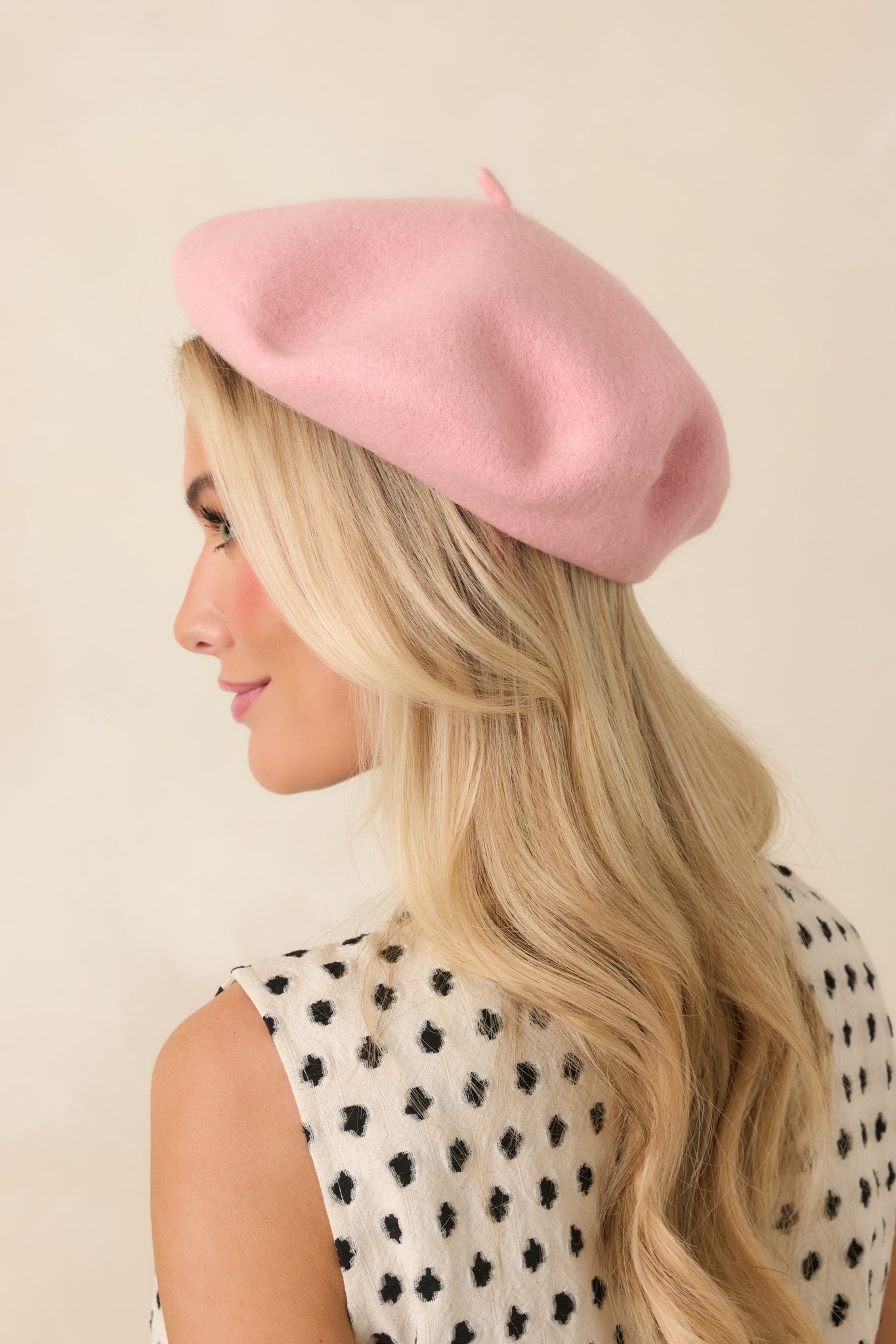 Rose pink beret with a polished round shape, lightweight wool fabric, and elegant everyday style.