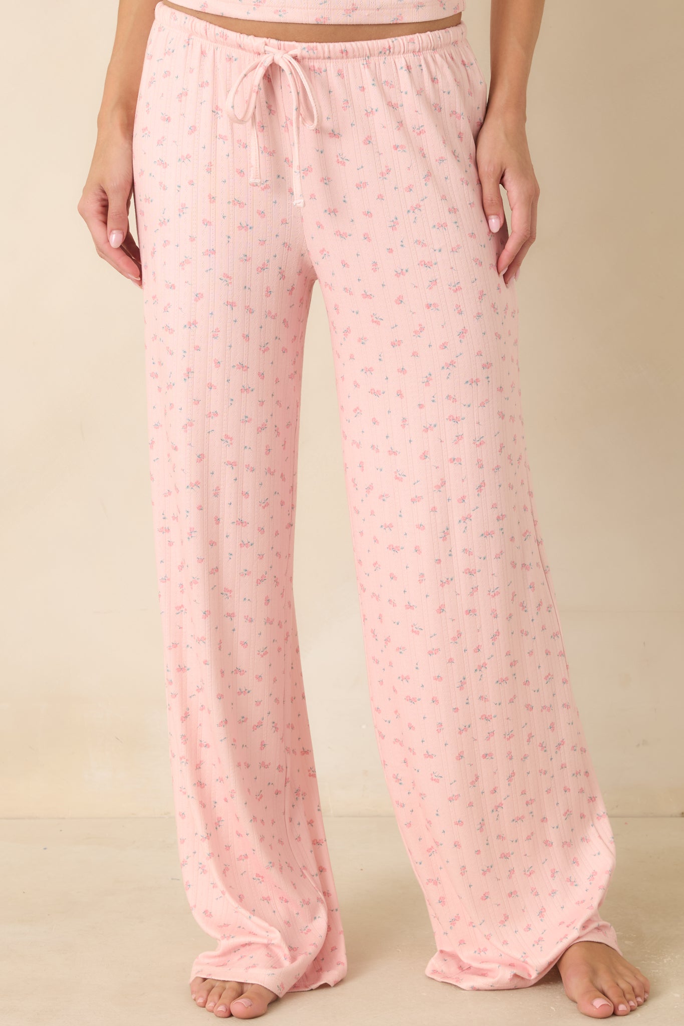 Detailed view of the rosebud floral print highlighting the silky pointelle texture and delicate pattern.