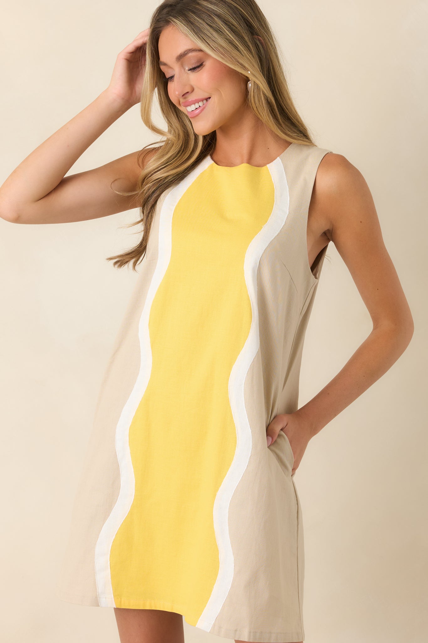Close view highlighting the classic round neckline and butter yellow center panel framed by ivory wave detailing.

