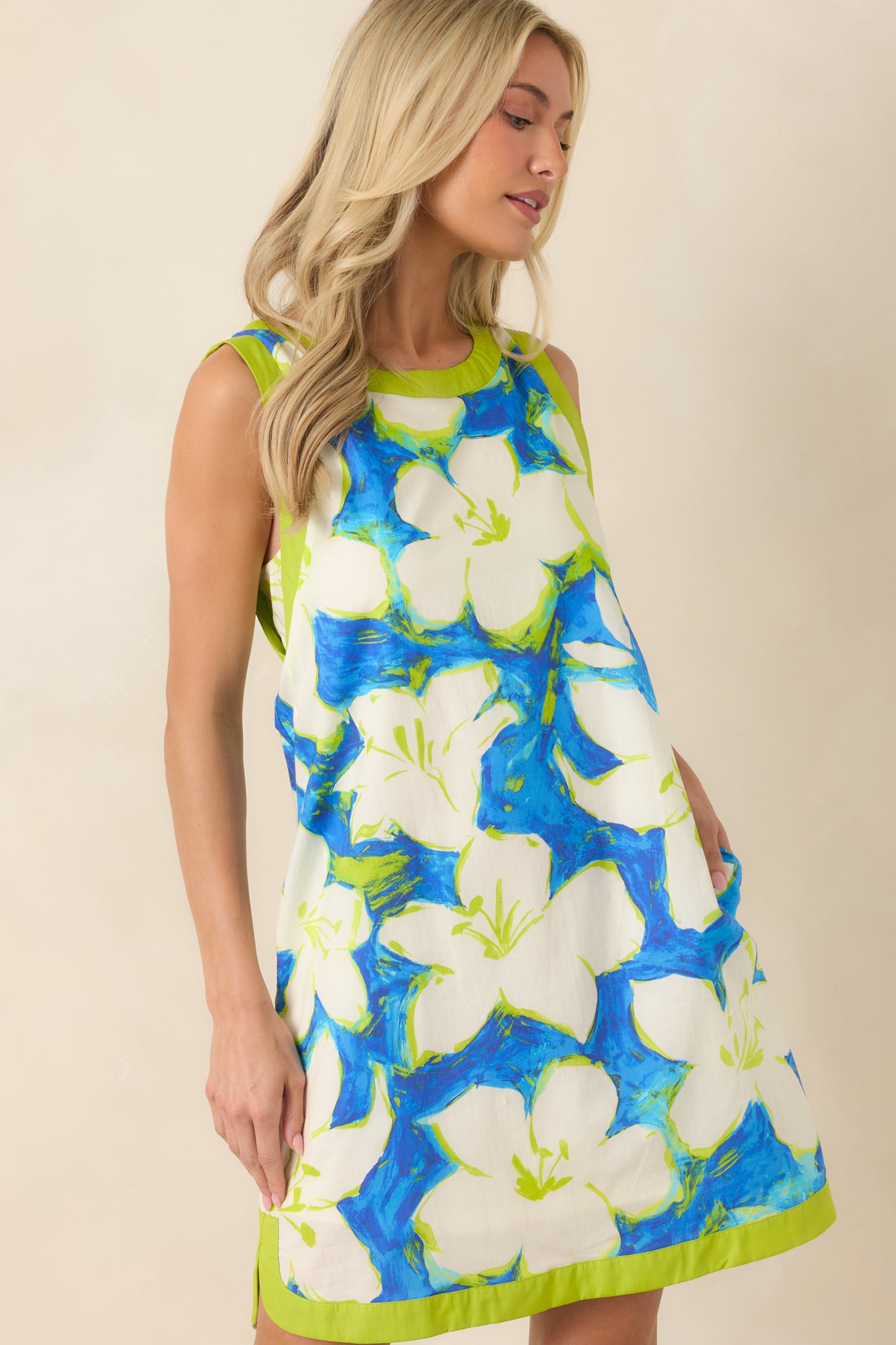 Close view of the round neckline with contrasting green trim detail.