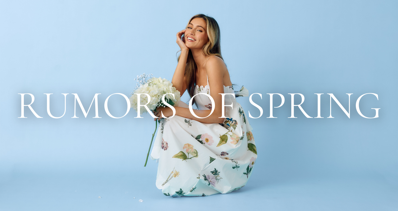 Woman in a floral dress holding flowers with 'Rumors of Spring' text on a light blue background.