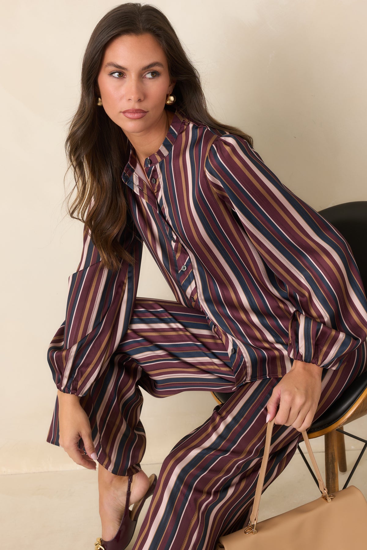 Satin blouse highlighting the band collar and multicolor striped pattern.