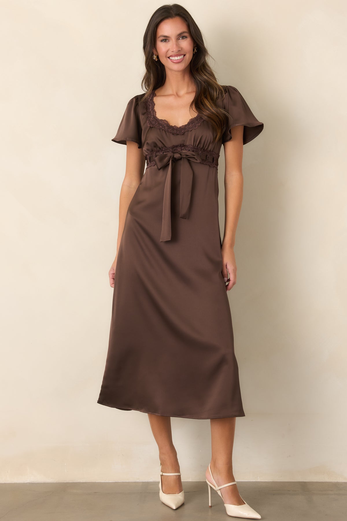 Satin dress showcasing tonal scalloped lace framing the empire waist and neckline.