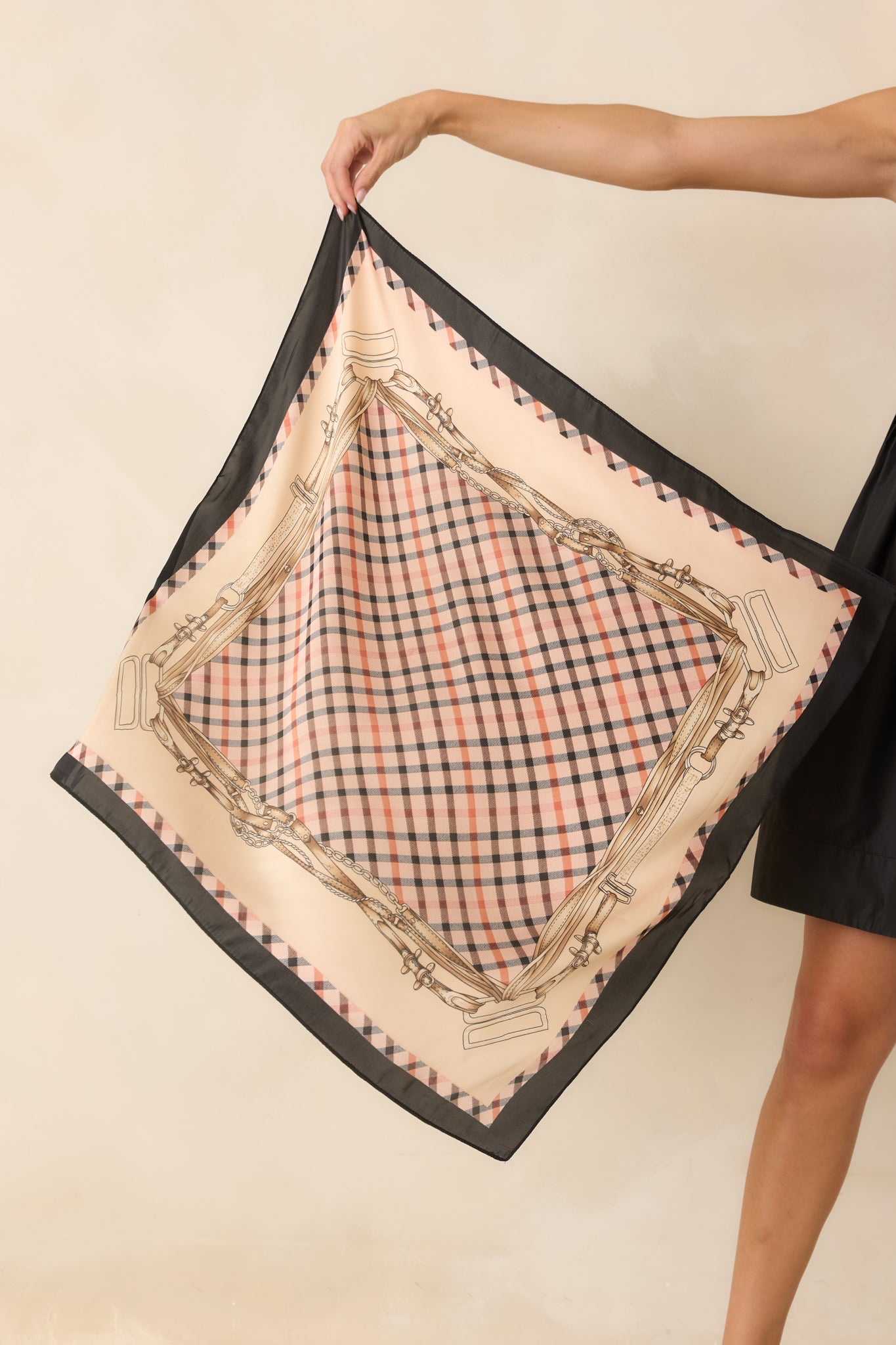 Satin hair scarf featuring a neutral plaid center framed by horse bridle, chain, and leather strap motifs.