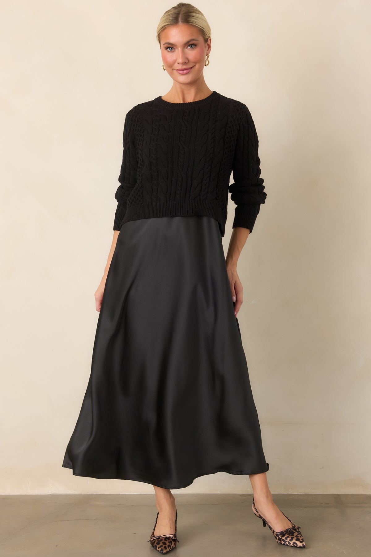 Satin maxi dress features a fluid drape and softly defined A-line shape beneath the textured cropped sweater.