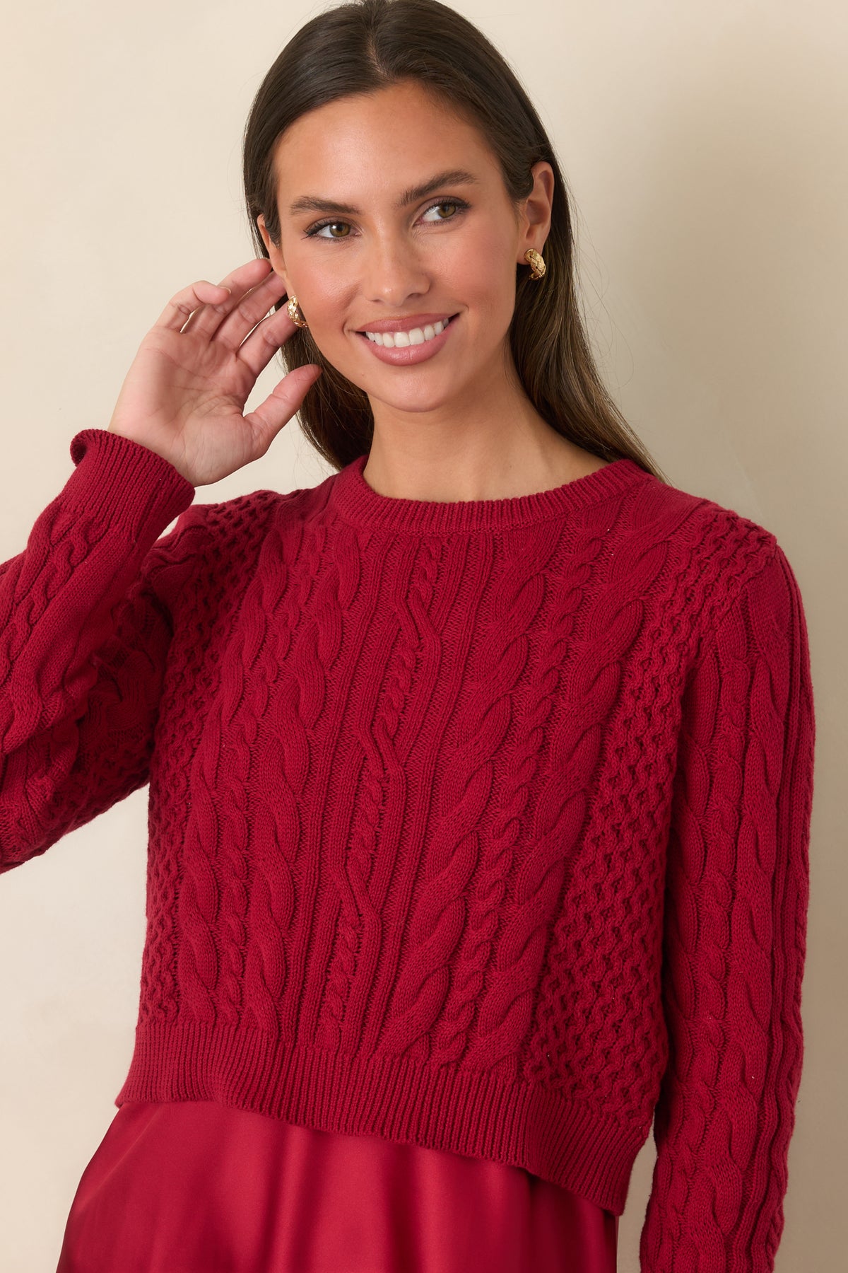 Cropped view of the satin maxi dress and textured sweater showcasing the layered silhouette.
