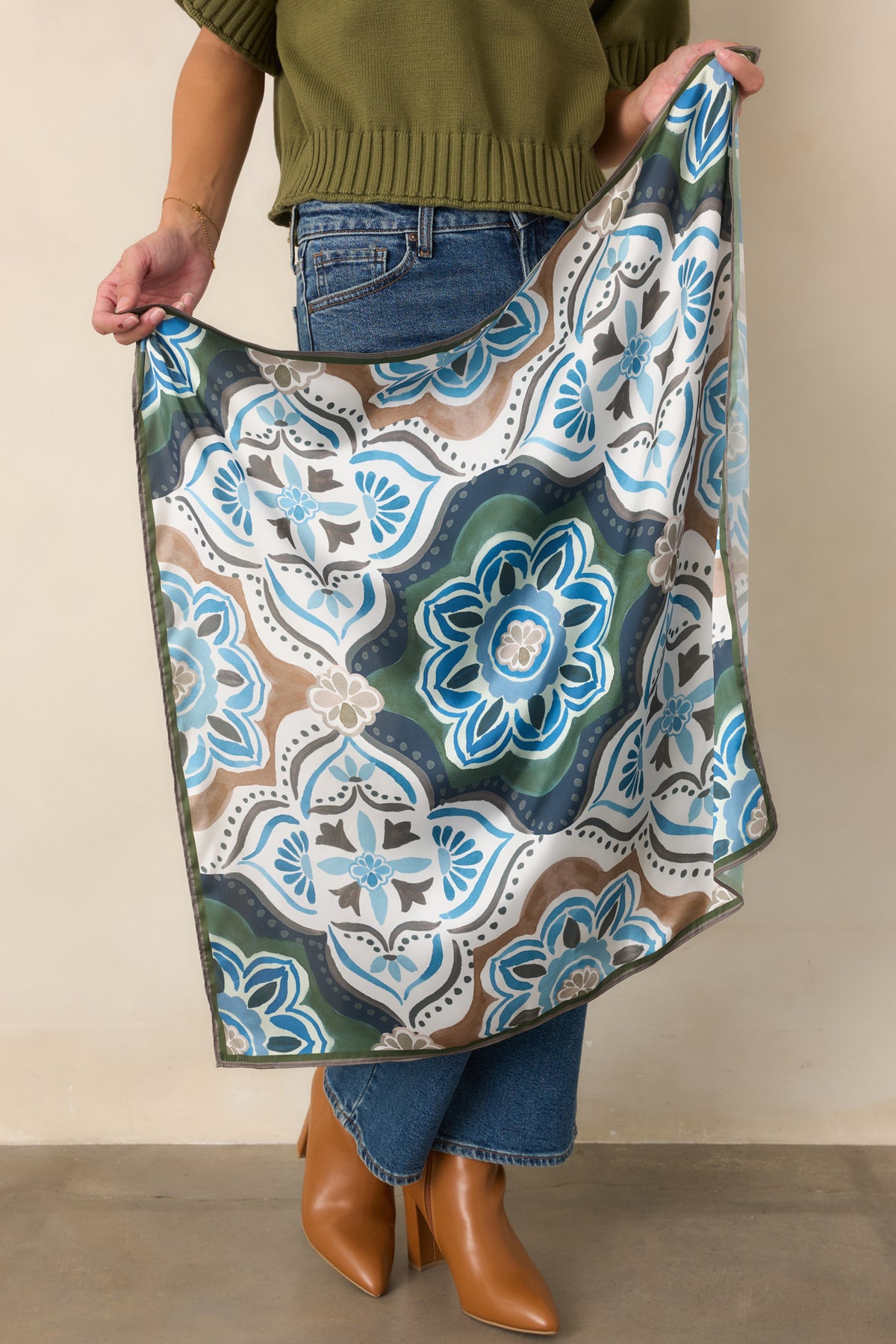 Close view of the silky satin weave, enlarged medallion pattern, and slim contrasting border.