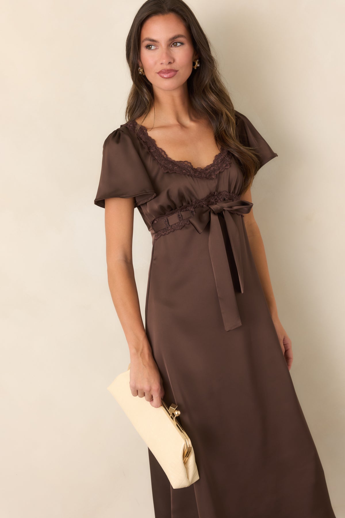 Satin midi dress featuring a threaded ribbon bow centered at the front.