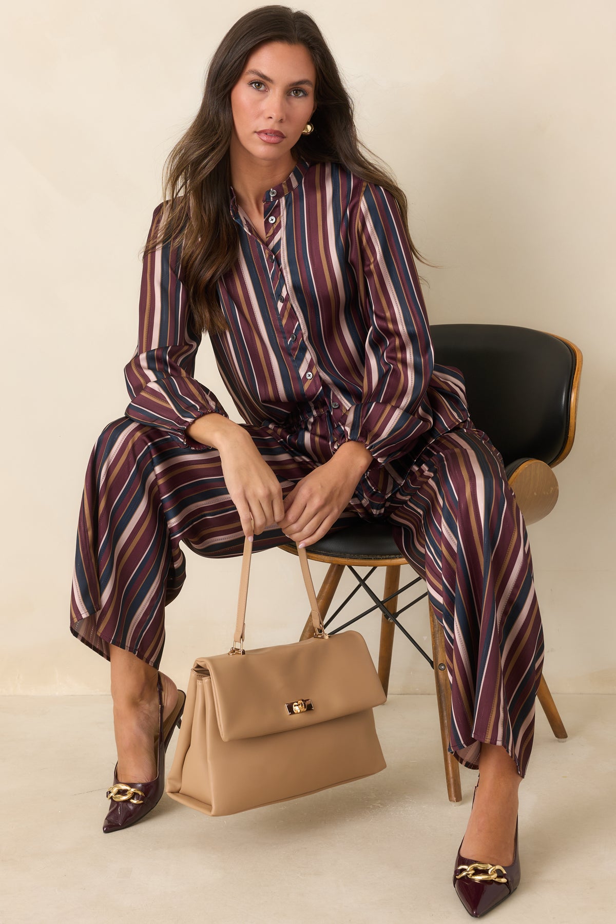 Satin top featuring a relaxed silhouette, long balloon sleeves, and band collar.