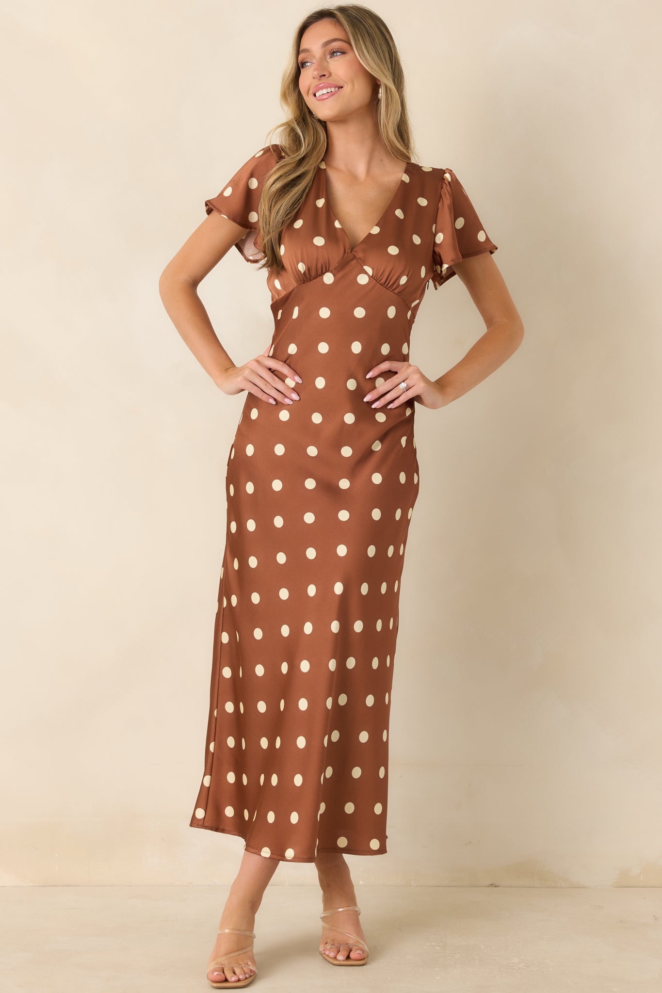 Chic satin midi dress with a surplice front, ivory dots, smooth lining, and polished tailored fit.