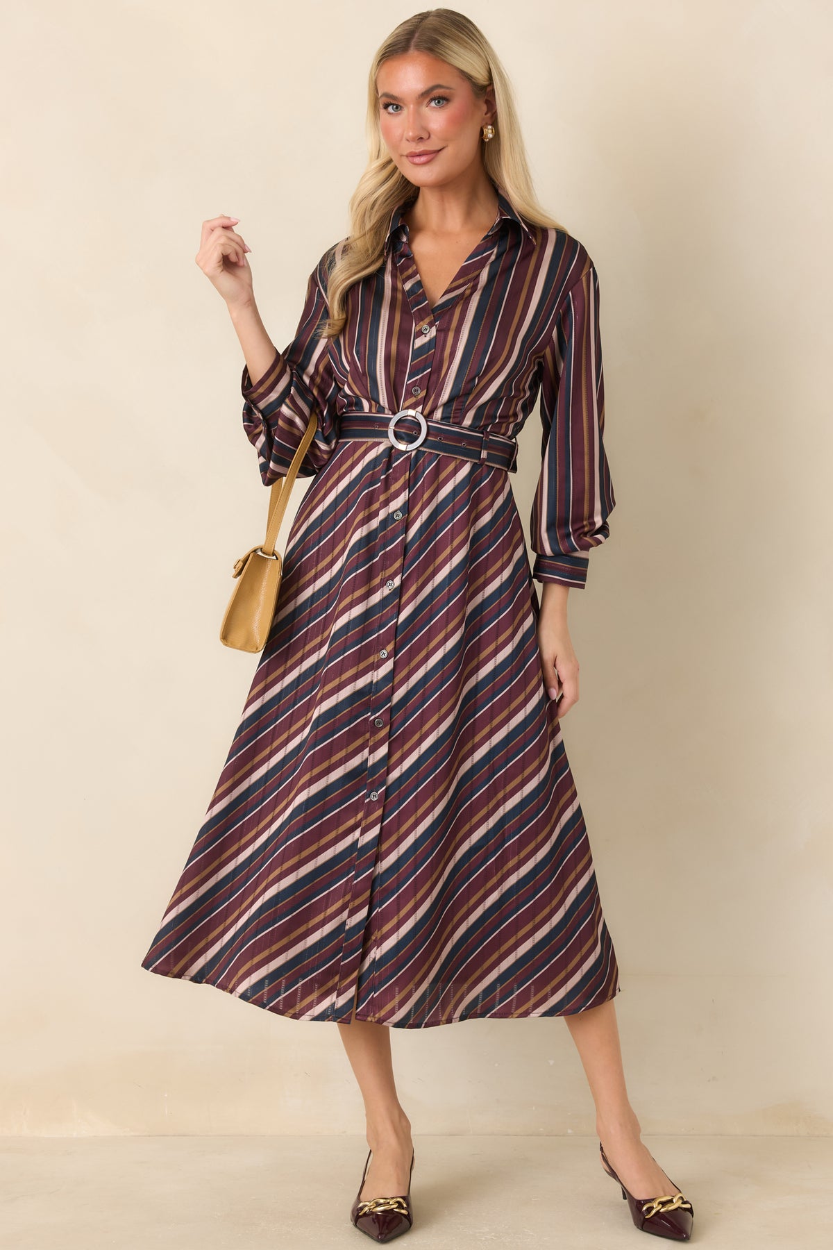 Multicolor satin dress featuring 3/4 length sleeves and a defined waist with matching belt.
