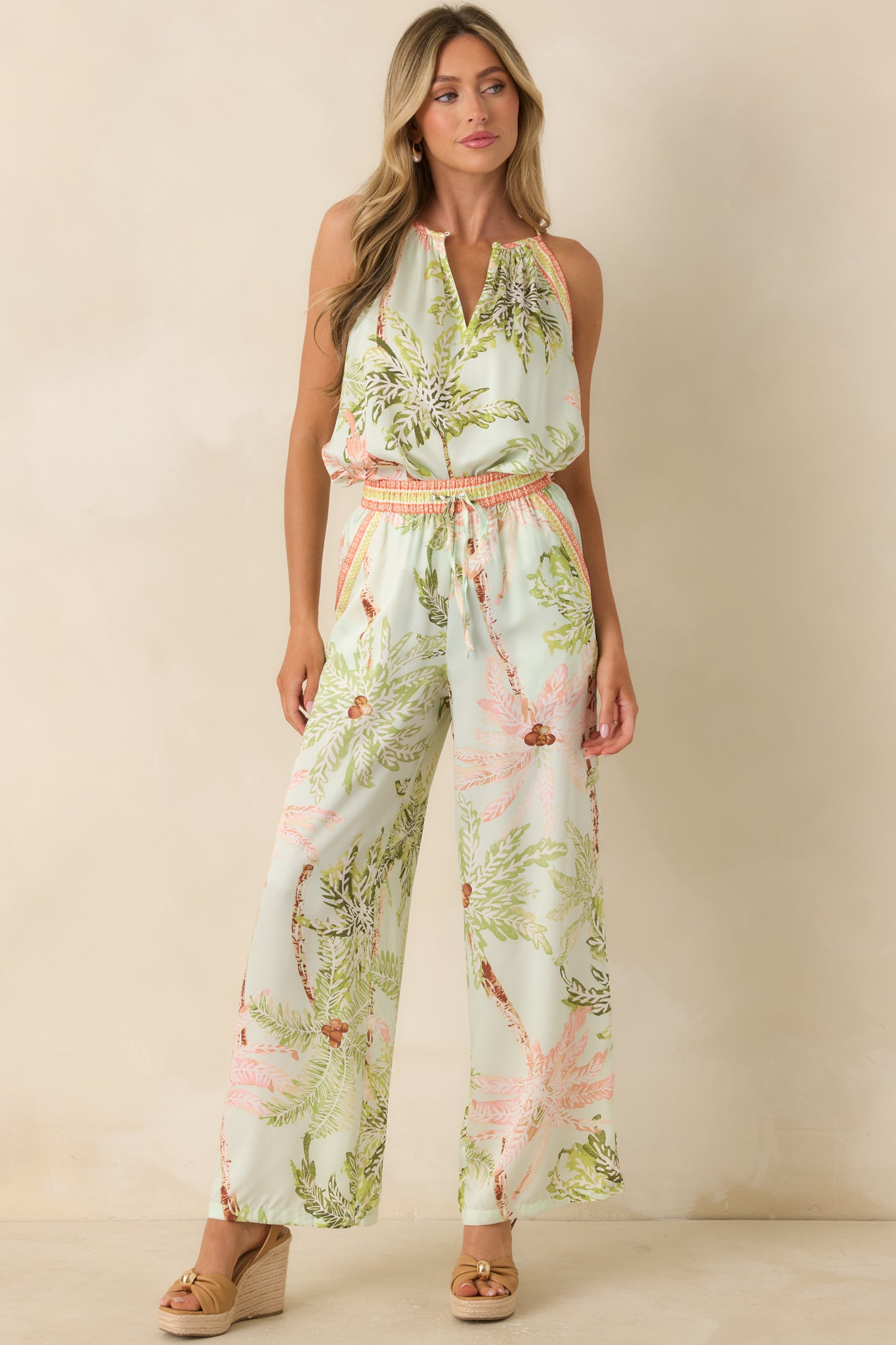 Seafoam tropical print top featuring a halter-inspired neckline, relaxed fit, and soft gathered detailing throughout.