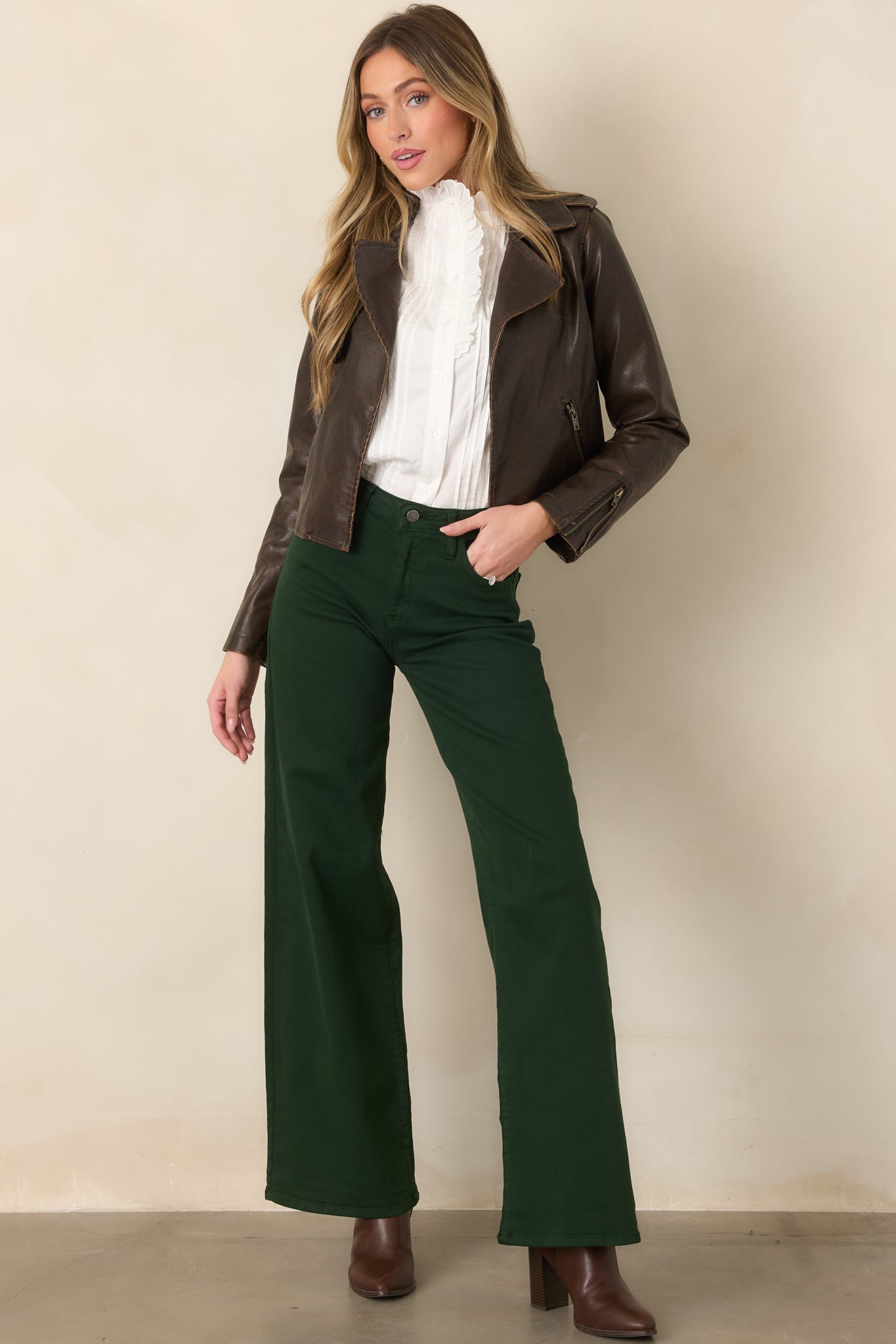 Seasonal green denim pants defined by a high-rise waistband, generous wide-leg cut, and softly structured finish.