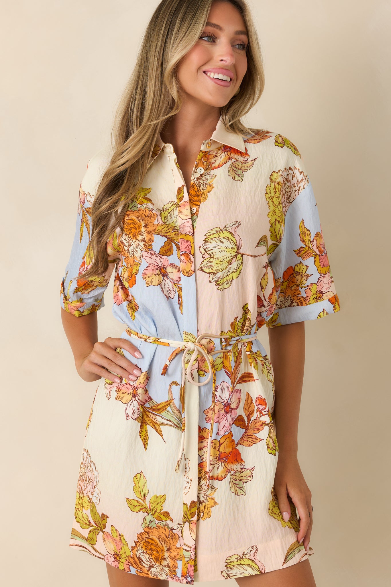 Removable self-tie belt highlights the waist while complementing the pastel floral print.