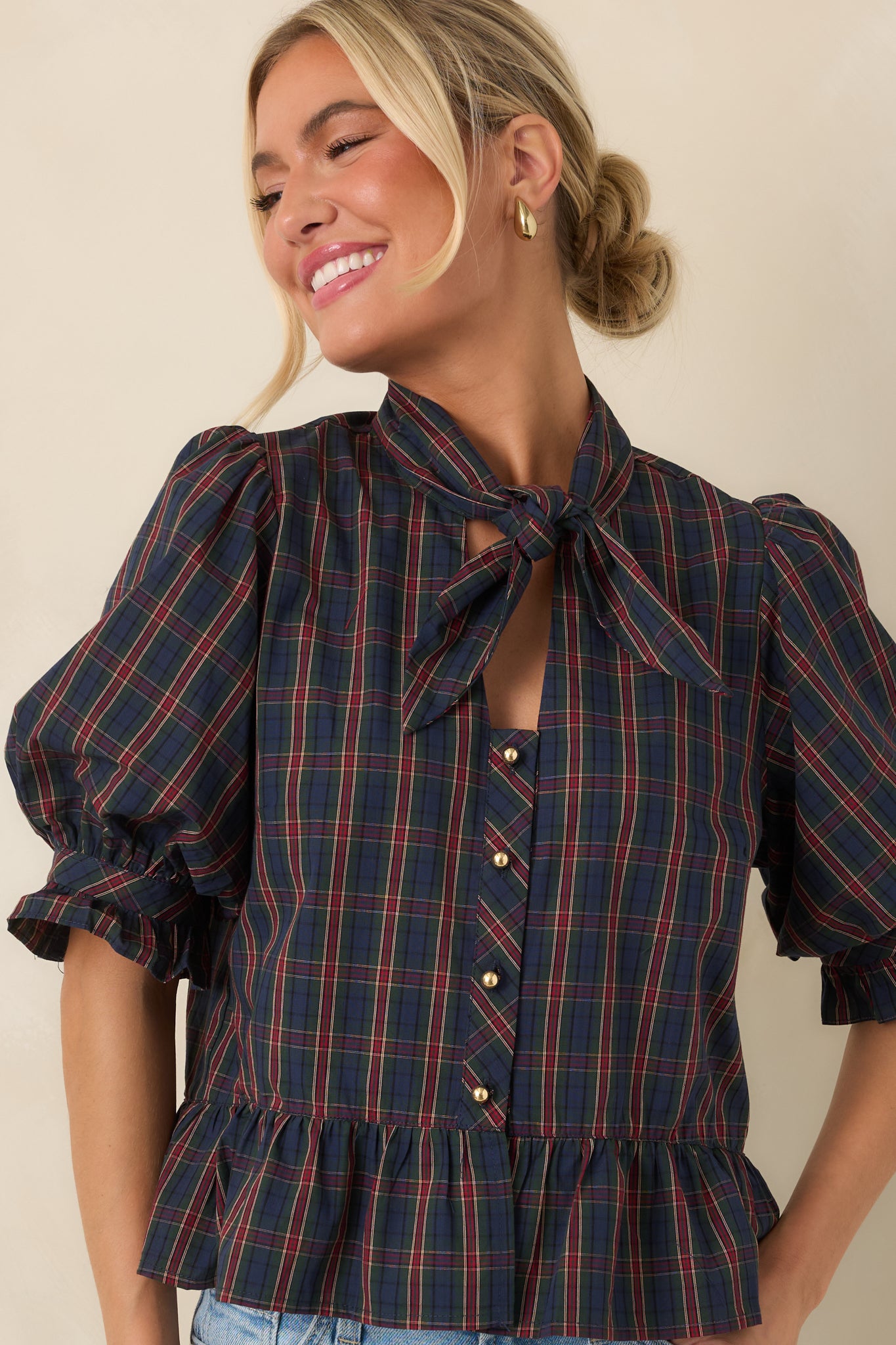 Gold-tone buttons and a fitted bodice define the refined look of this self-tie blouse.