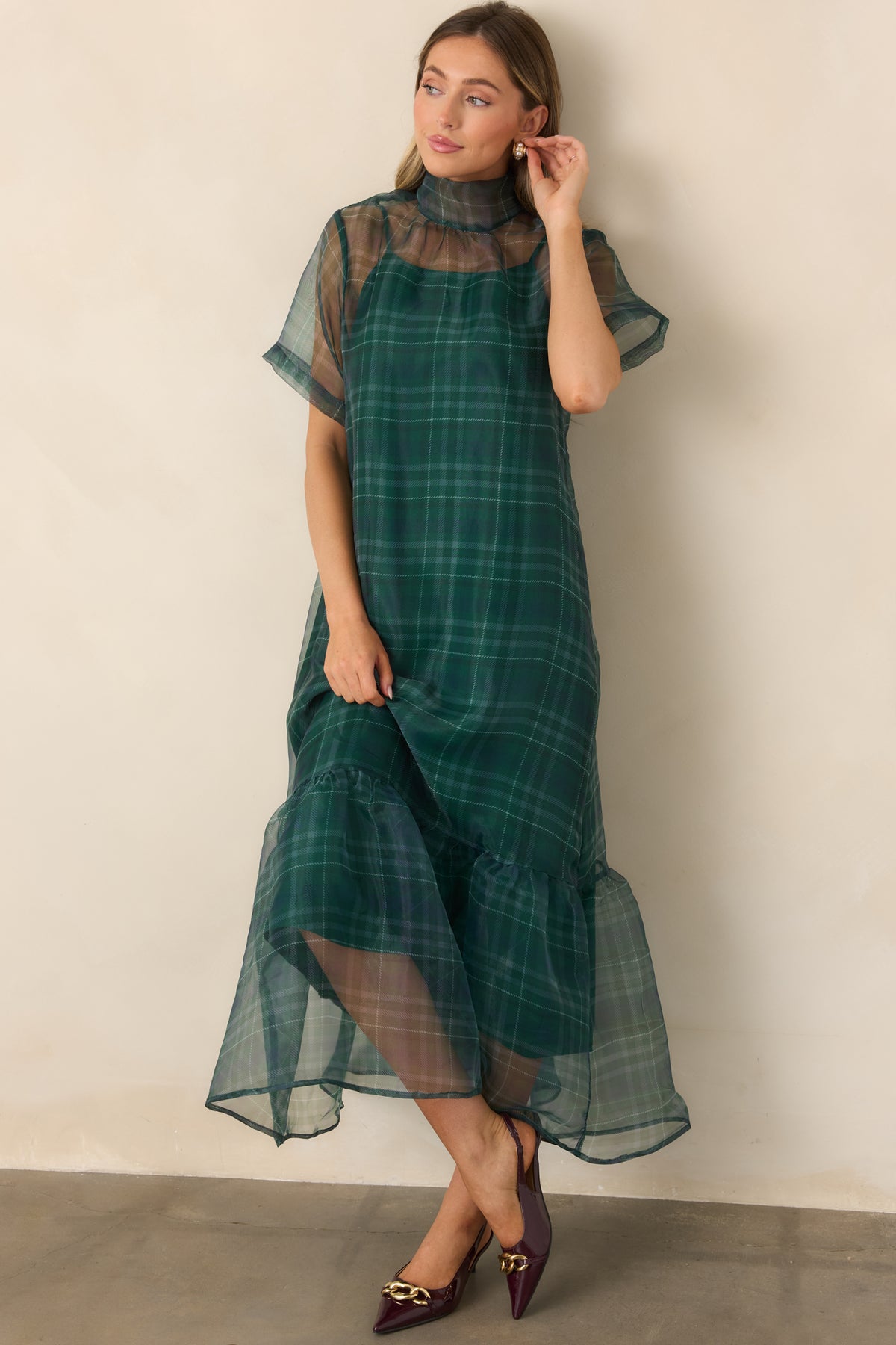 Sheer plaid emerald maxi featuring a graceful high neckline and softly released full-length skirt.