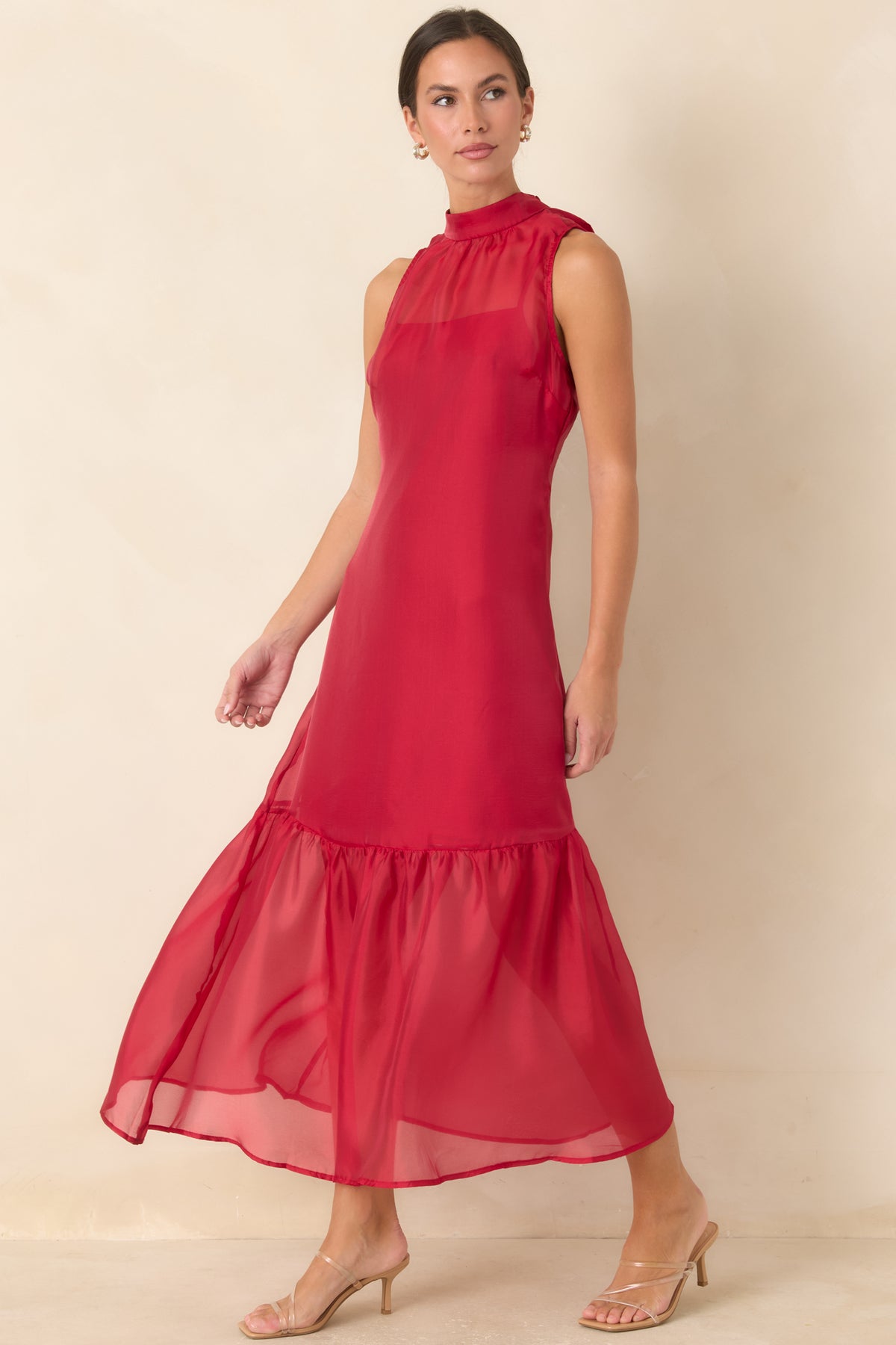 Sheer overlay dress with a flowing maxi skirt and softly gathered hemline for delicate movement.

