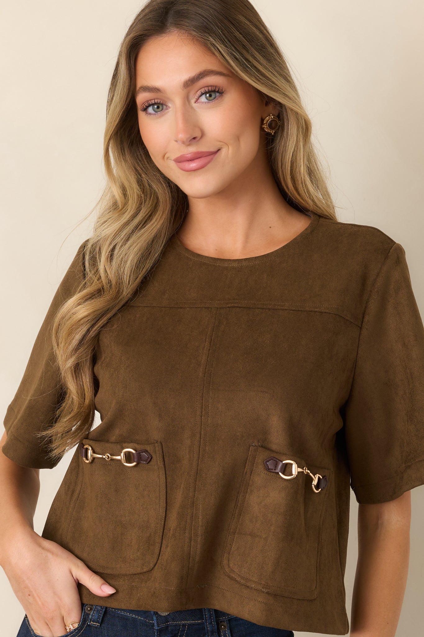 Short-sleeve top showcasing the soft suede-like texture, round neckline, and relaxed boxy construction.