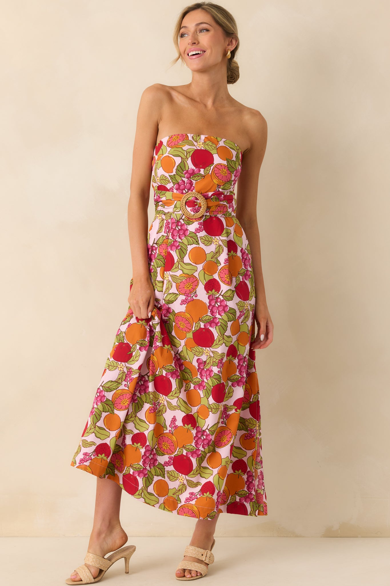 Frontal shot of the dress highlighting the leg slit on one side and the relaxed, floor-length silhouette.