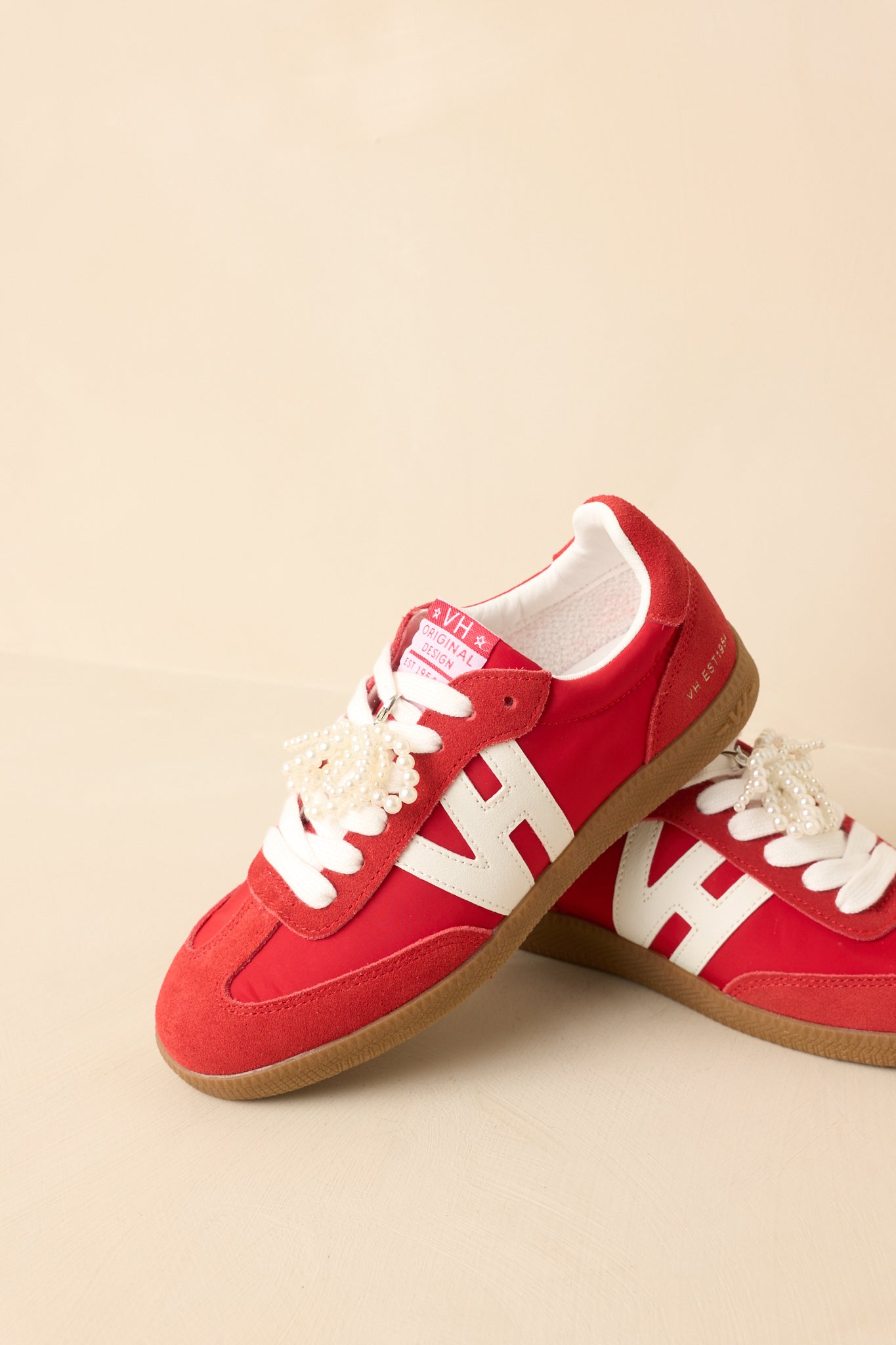 Front-side angle emphasizing lace-up structure and bold red color.