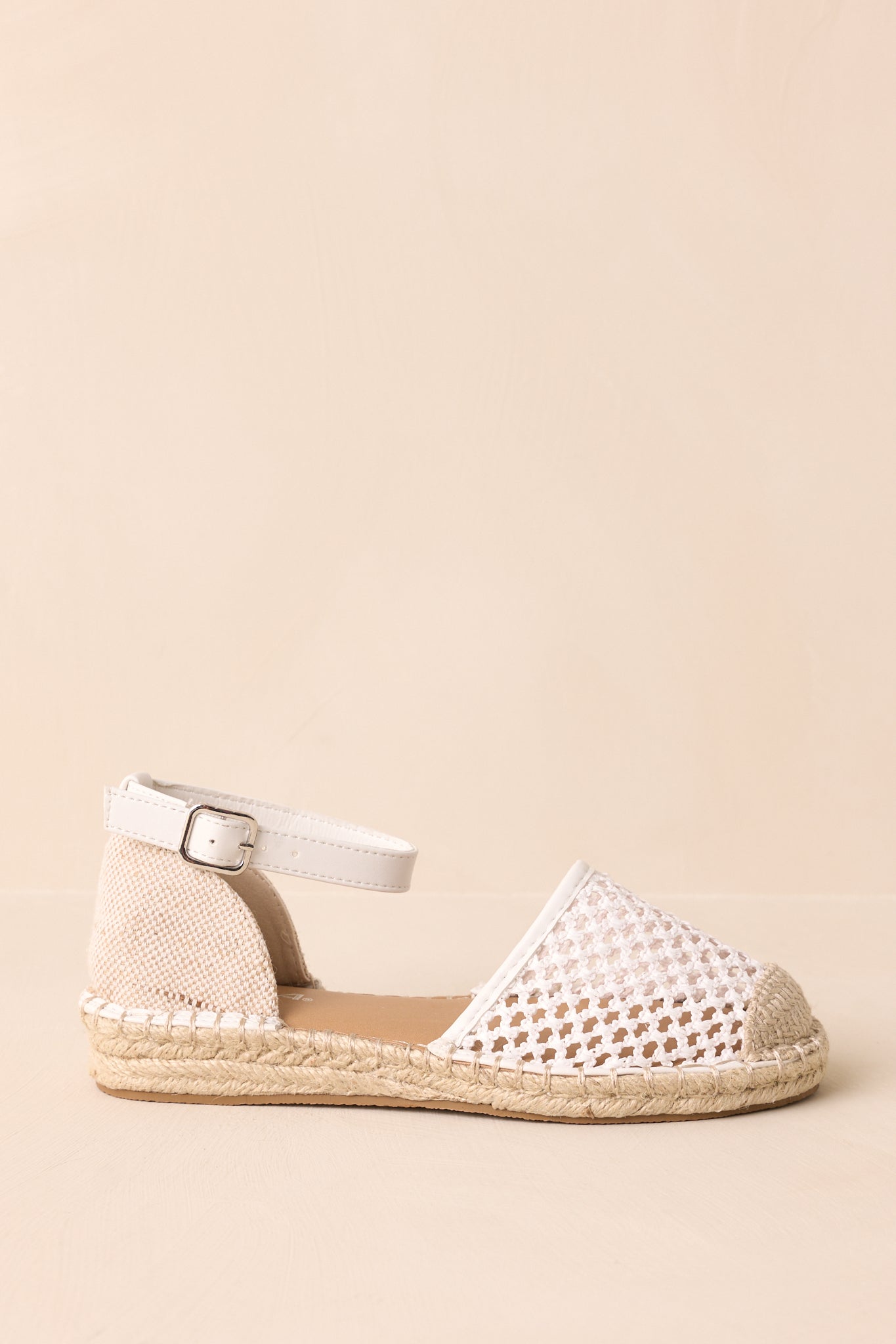 Side cropped view highlighting the adjustable ankle strap and woven upper texture.