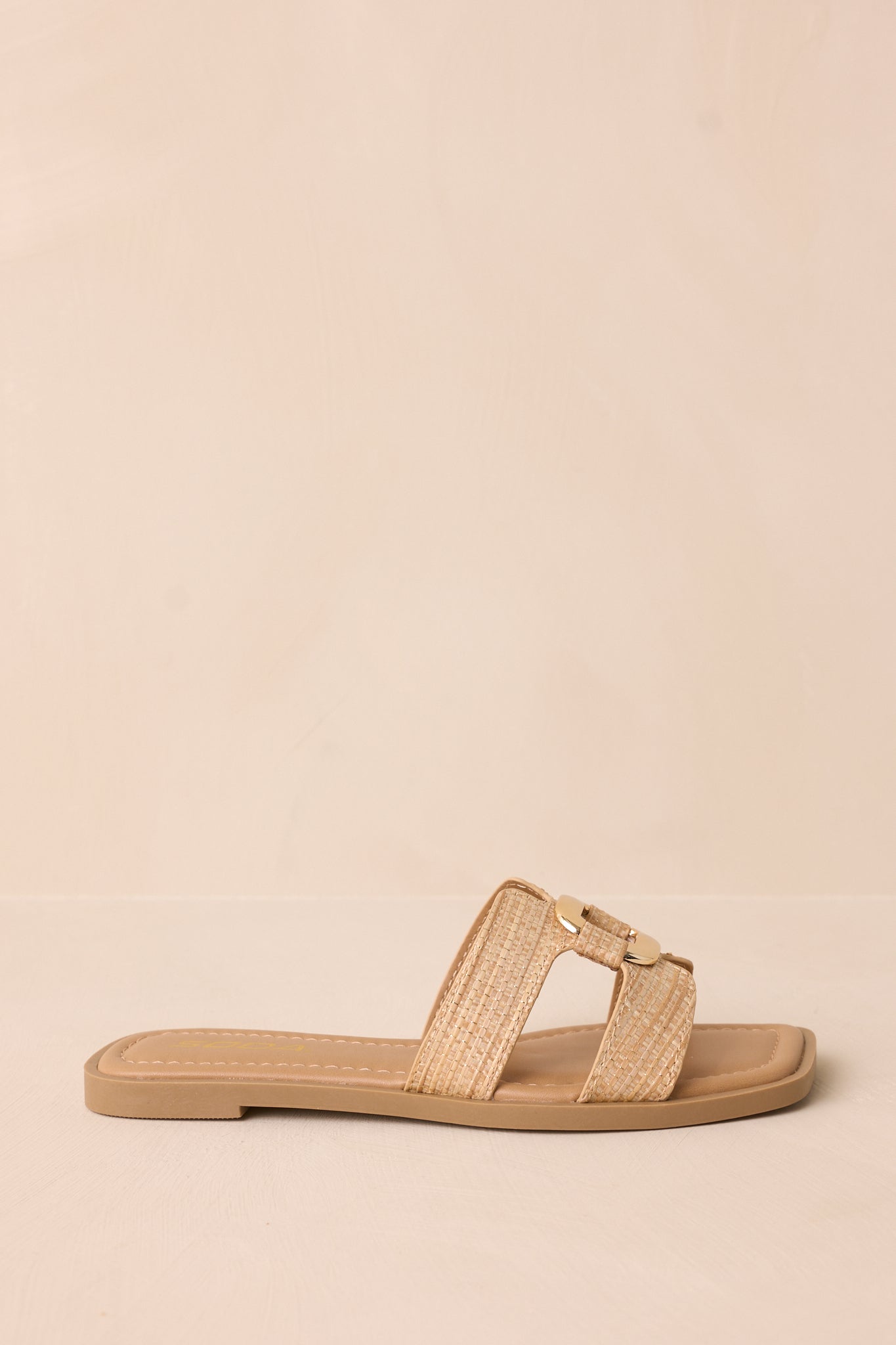 Another side profile shot highlighting the sandal’s silhouette and strap pattern.
