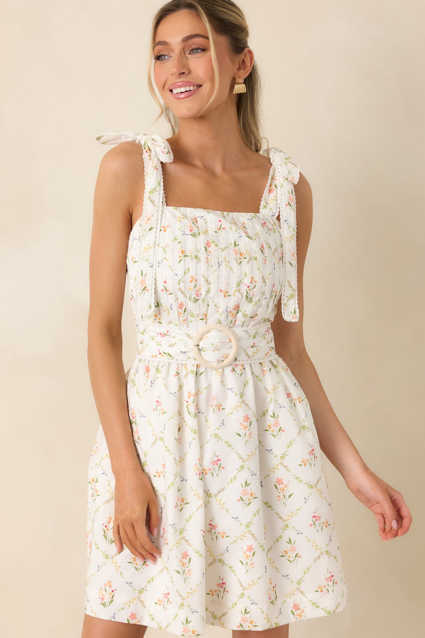 Side seam pockets adding functional detail to cotton mini dress.