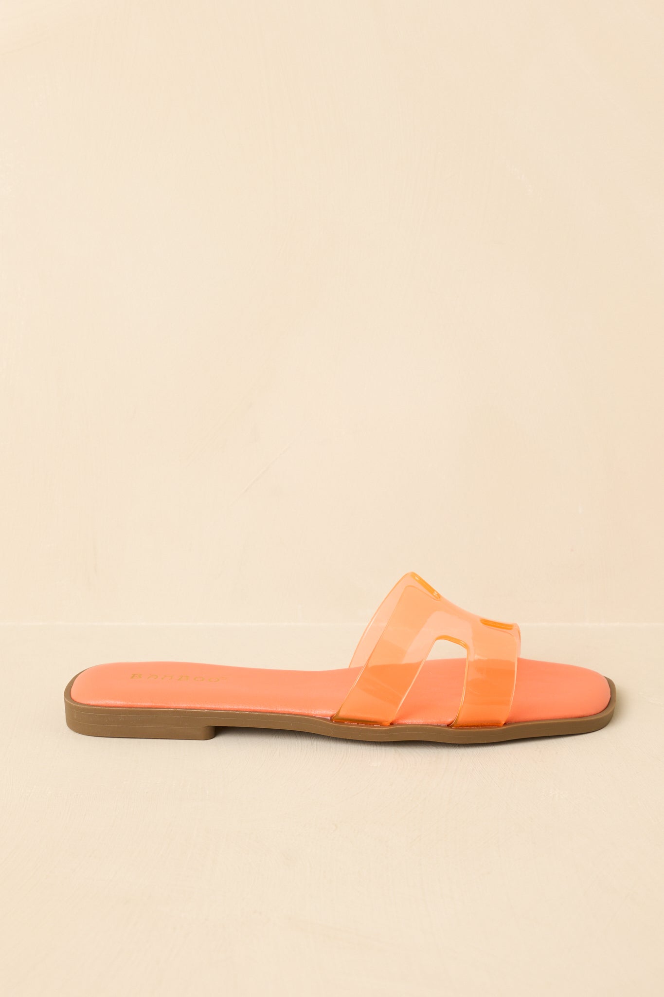 Side profile view highlighting the low-profile silhouette and even, streamlined sole.
