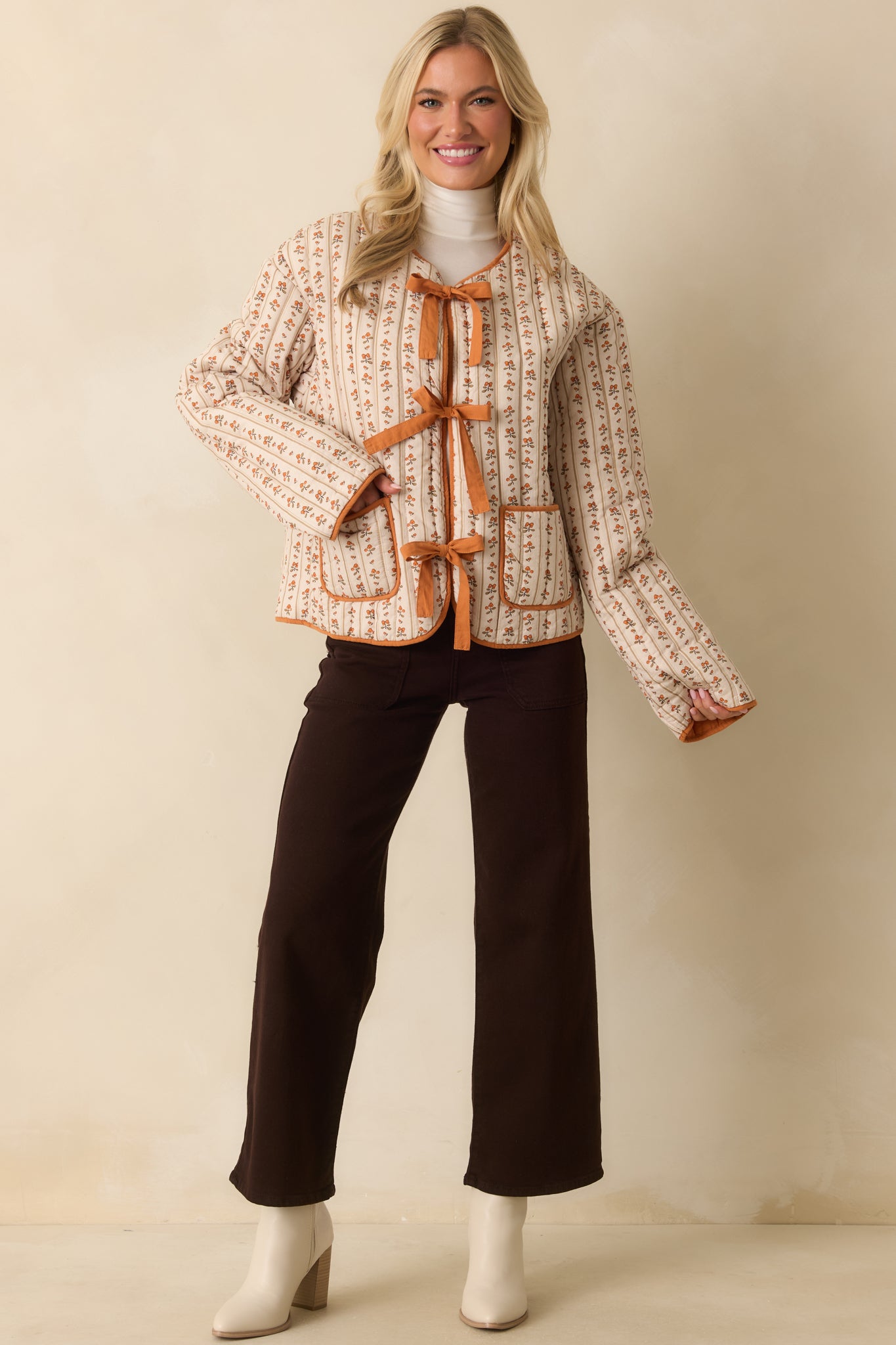 A complete profile of the jeans highlighting the wide leg fit and button zipper closure.