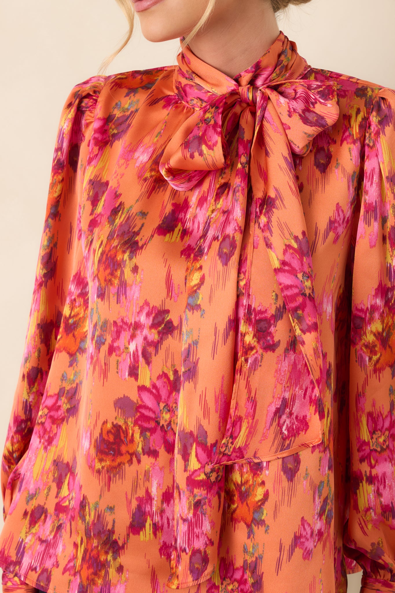Close-up of the silky polyester satin fabric, showcasing its soft sheen, smooth texture, and flowing drape.