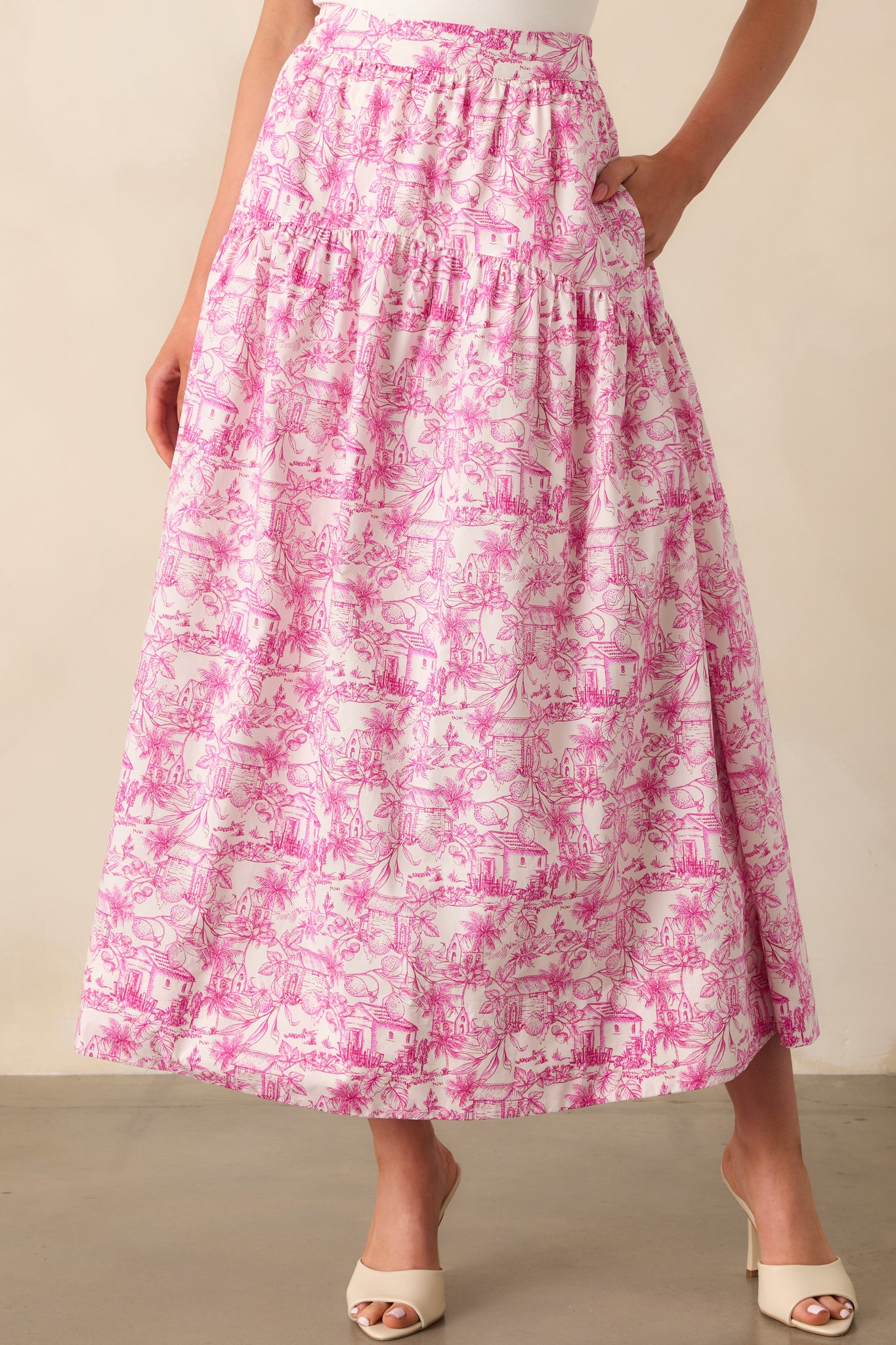 Close-up crop of the skirt’s waistband area, showing the pink print and relaxed drop waist seam.