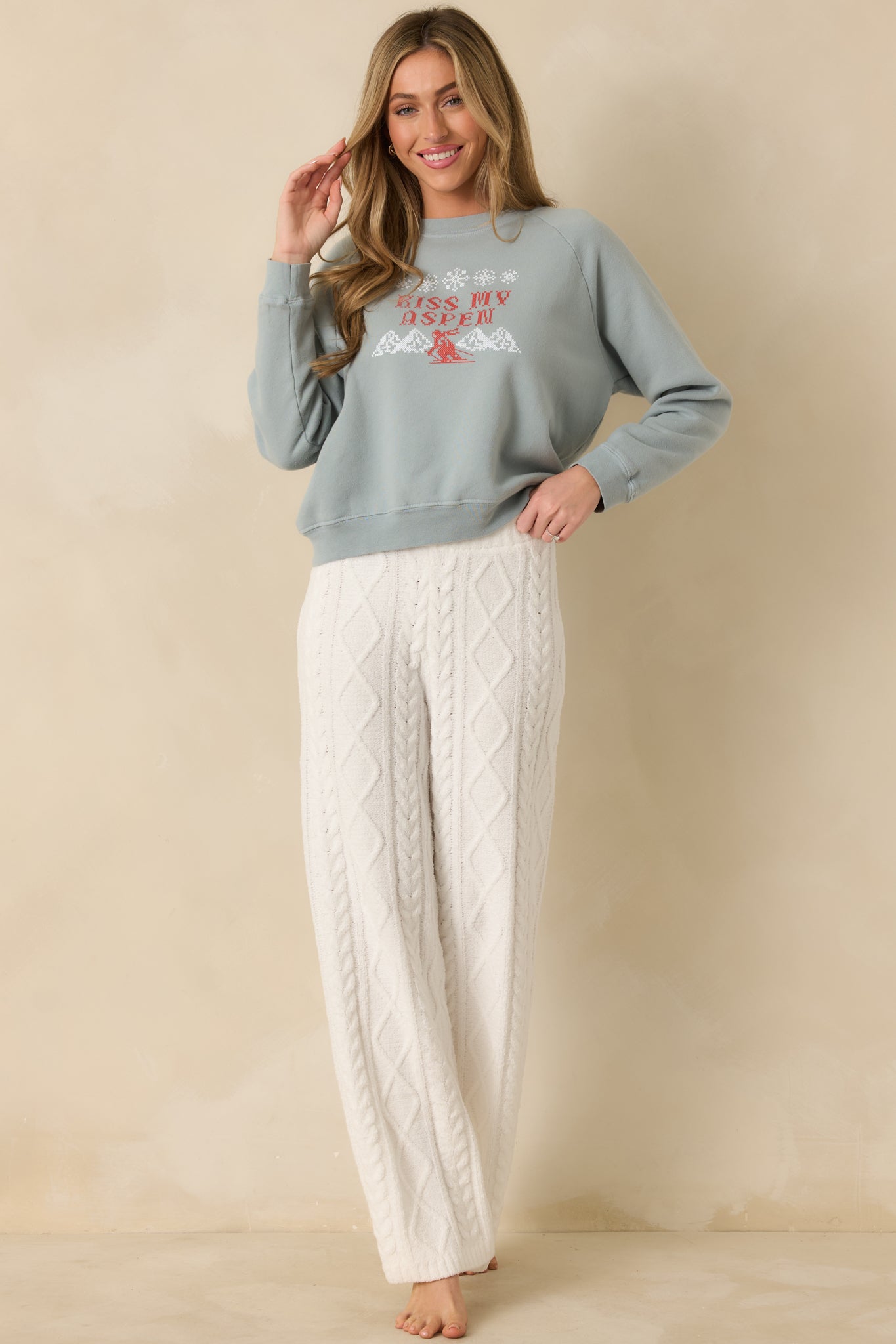 Slate blue fleece sweatshirt featuring the playful winter skier graphic across the front.