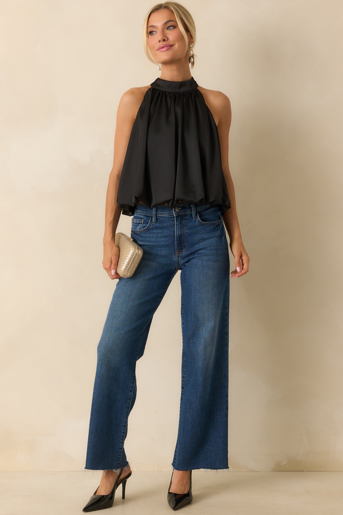 Sleek satin halter top with a high neck and easy, blouson shape for a refined finish.