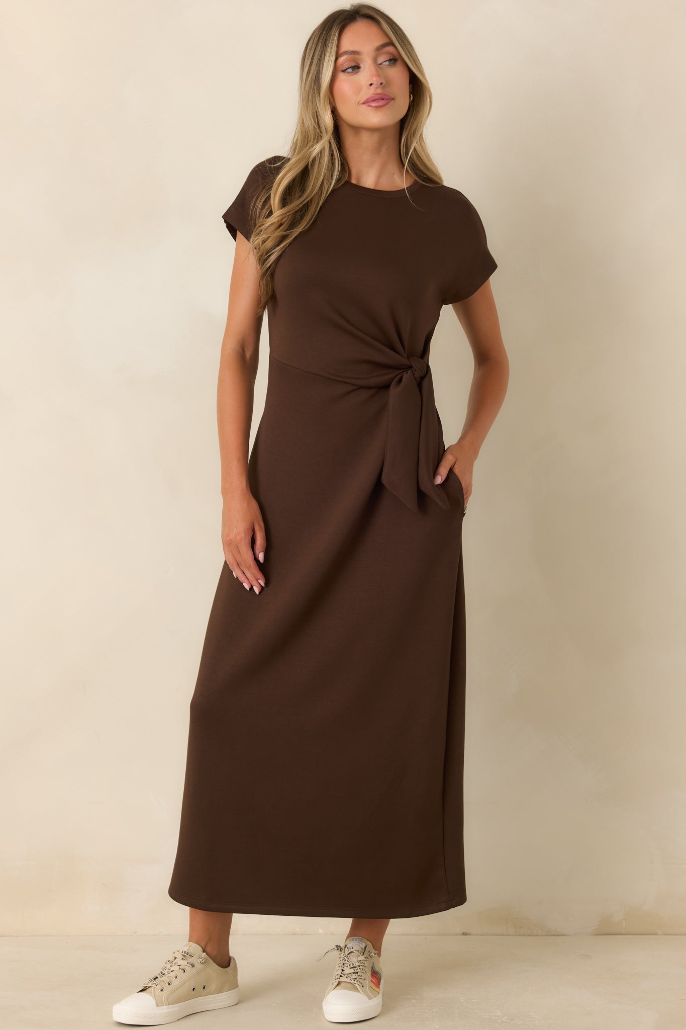 Sleek midi dress featuring a waist tie accent, smooth fabric finish, and comfortable stretch design.