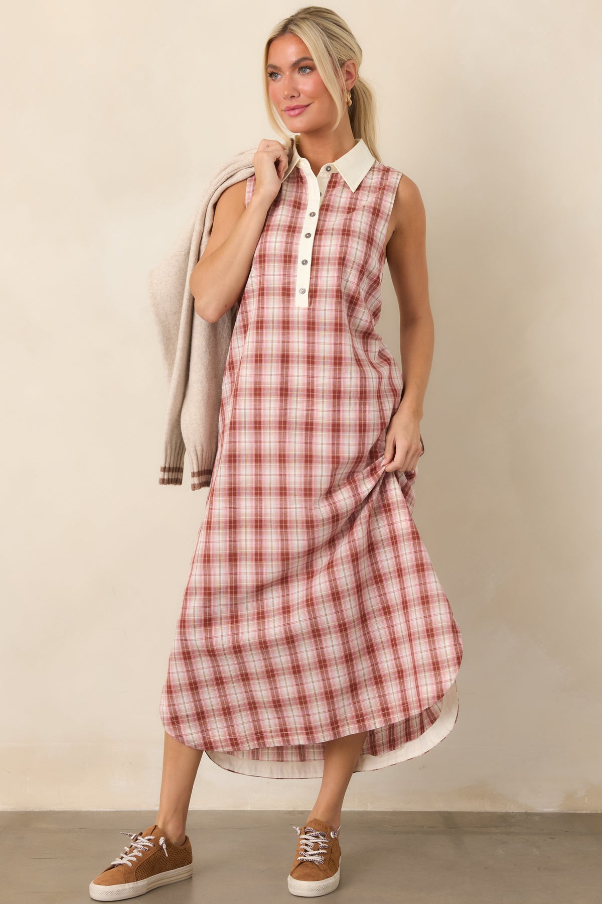 Sleeveless cotton dress showcasing its polished collared neckline, tonal button-front placket, contrasting trim, and easy silhouette.