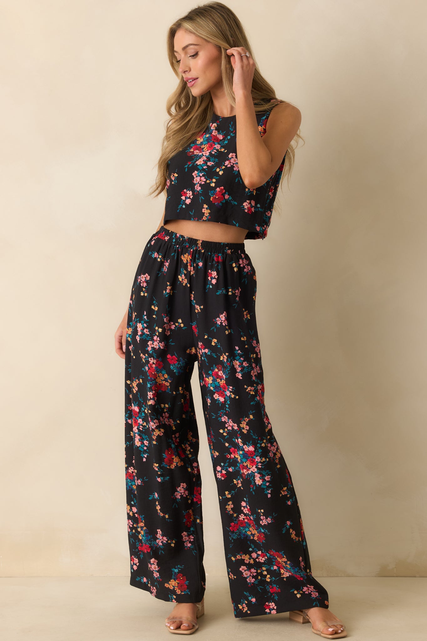 Crop top showing the sleeveless cut and flowy structure over the torso.