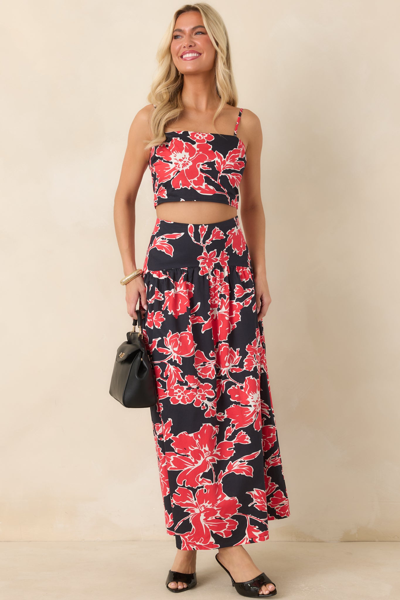 Sleeveless floral top with a modern square neckline, flexible fit, and lightweight cotton construction.