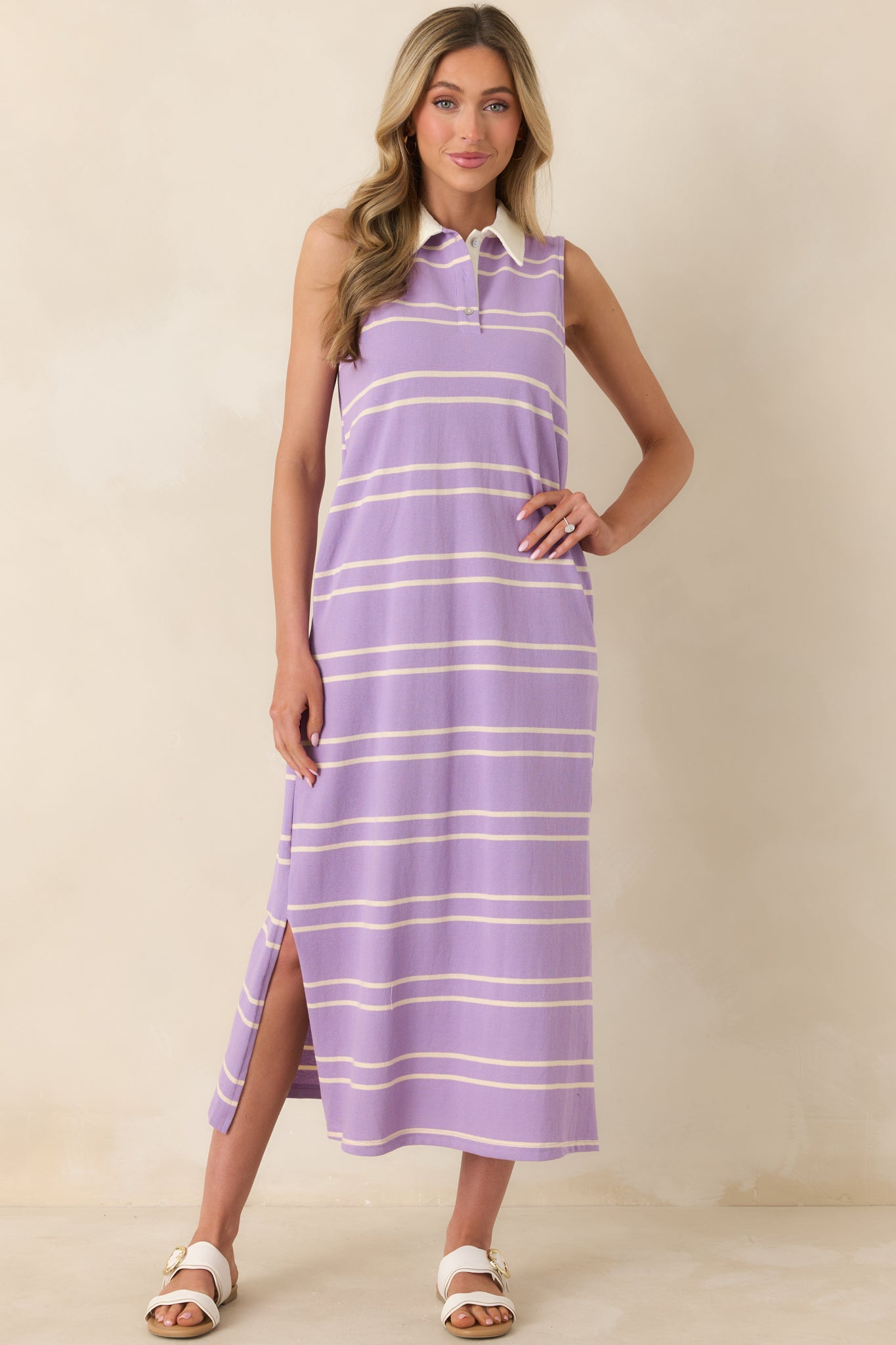 Sleeveless lavender and neutral striped dress with a structured contrasting collar and partial button placket.