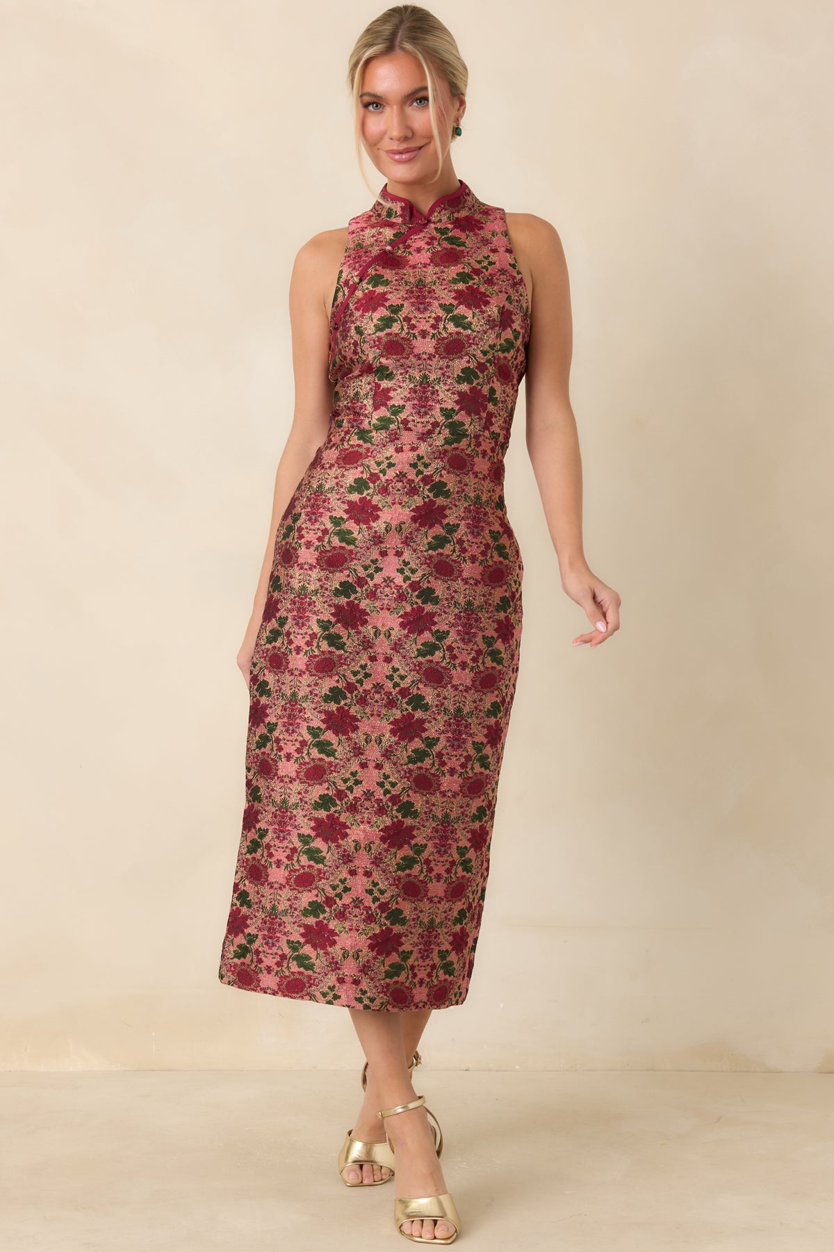 Sleeveless rose midi dress with burgundy blooms, deep green foliage, and decorative front buttons.
