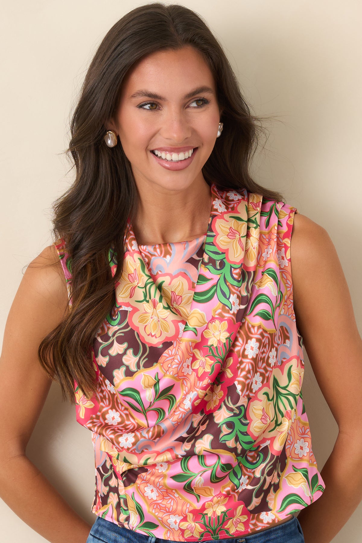 Sleeveless satin top displaying the draped neckline and gathered detailing across the front.