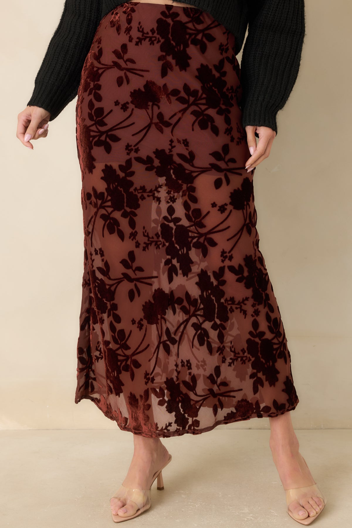 Slim burgundy skirt with velvet floral motifs arranged across a translucent mesh base.