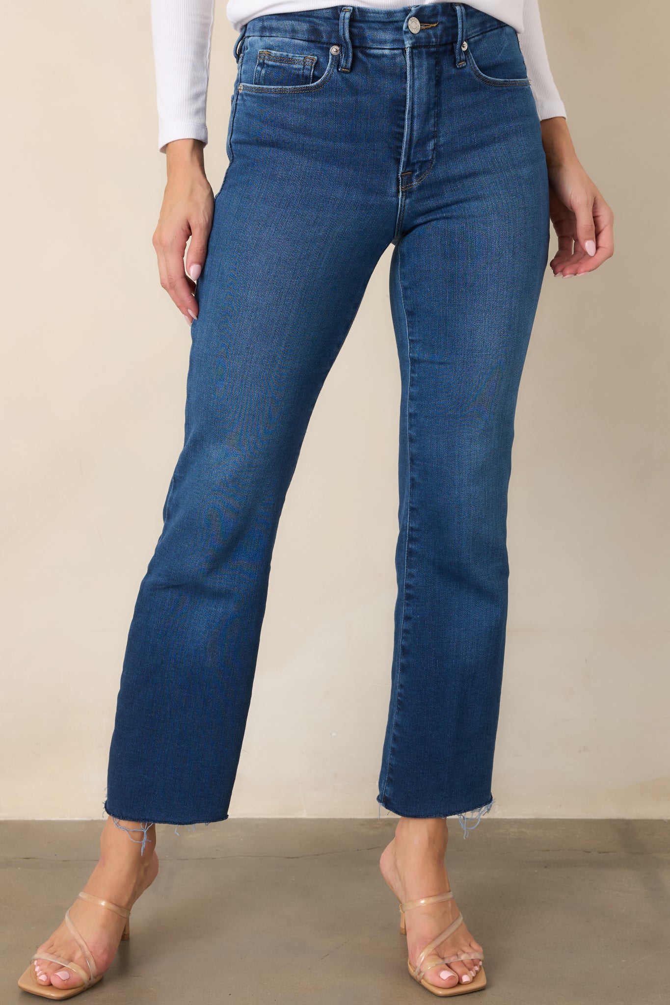 Detailed view of the jeans showcasing the streamlined upper-leg fit and subtle cropped bootcut shape.